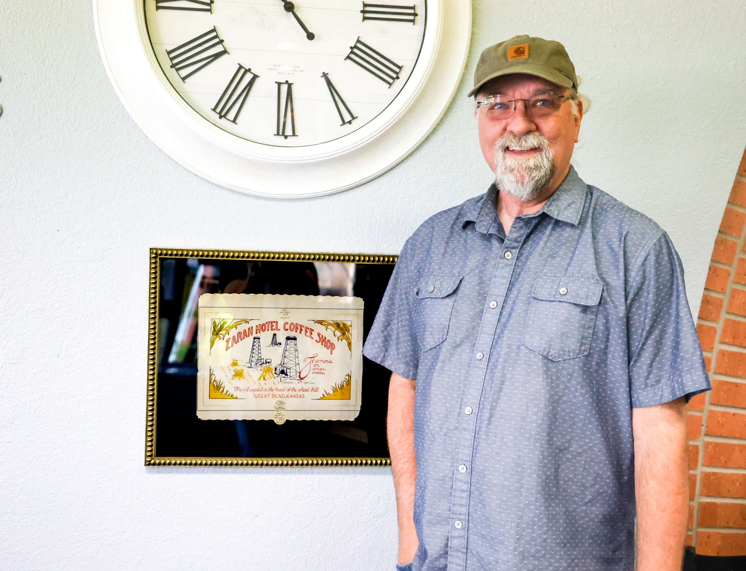 Ron Weathers with historic placemat at Perks Coffee Shop