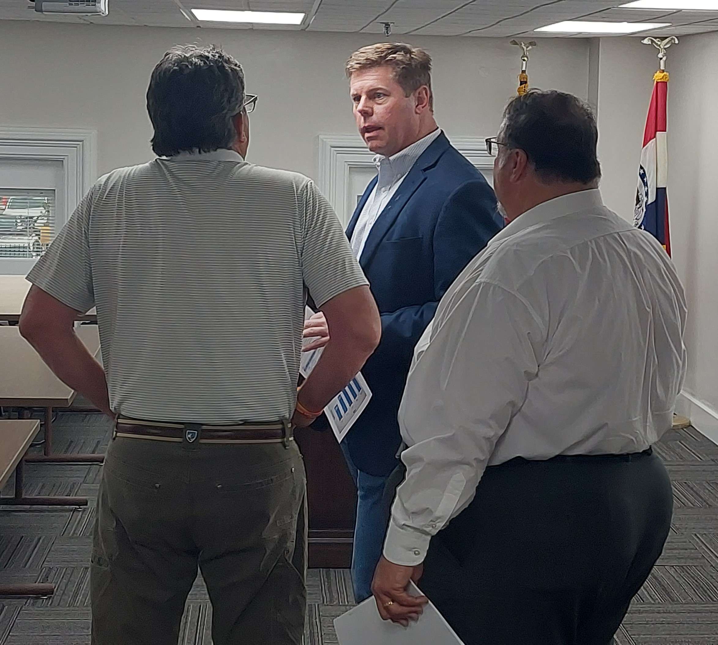 Missouri House Speaker Dean Plocher speaks with Presiding Buchanan County Commisioner Scott Nelson as Representative Dean Van Schoiack looks on/ Photo by Matt Pike