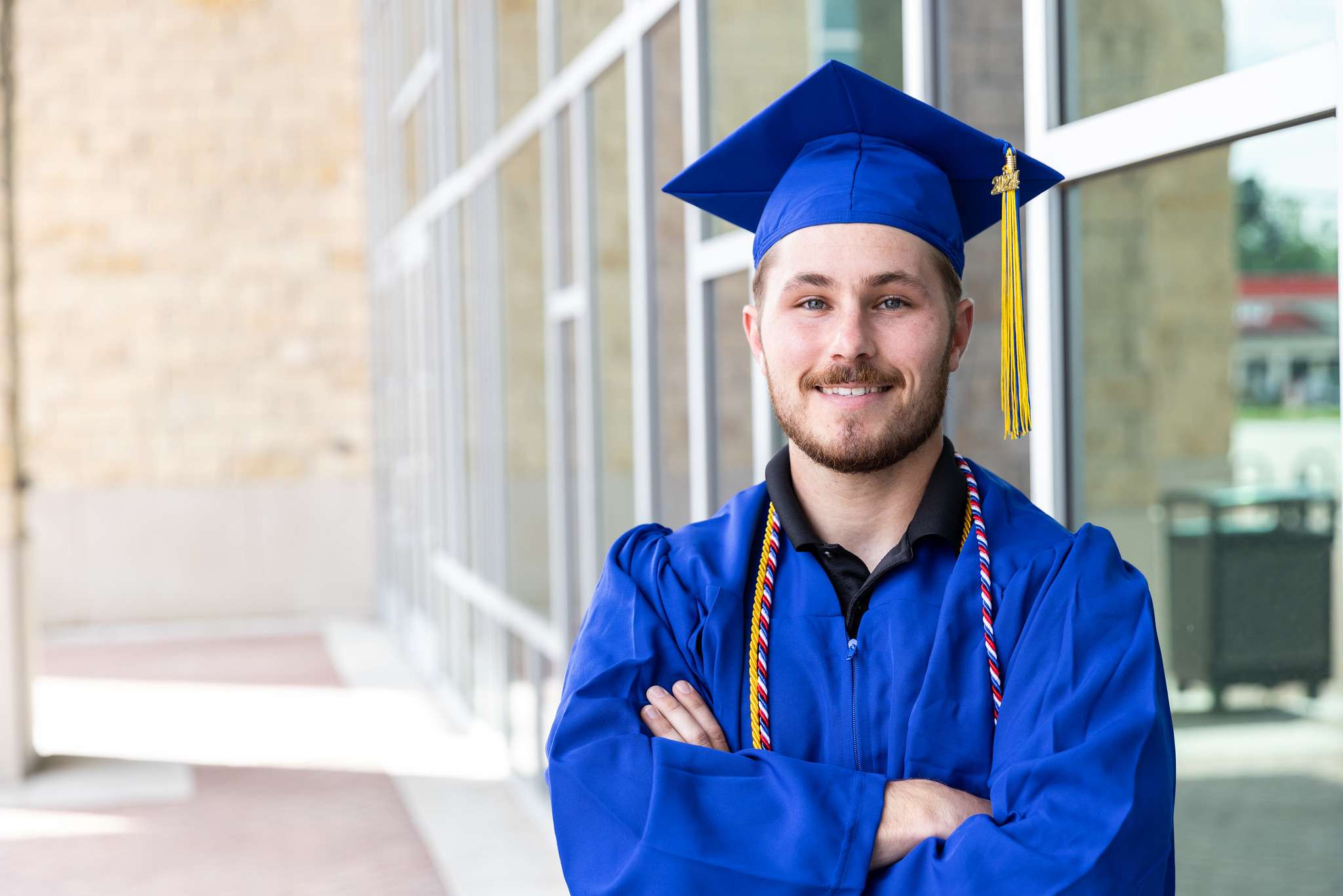 Barton Community College at Fort Riley student and active-duty Soldier Niko Coldren pauses for a photo before the Fort Riley Education Services commencement ceremony Thursday afternoon in Manhattan.