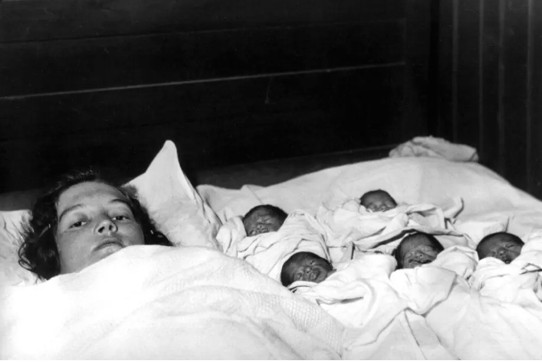 Elzire Dionne is shown with her five girls shortly after their birth in Corbeil, near Callander in northern Ontario, Canada, on May 28, 1934. The identical quintuplets, born at least two months premature, are the first known quintupletes to survive infancy. (AP Photo)
