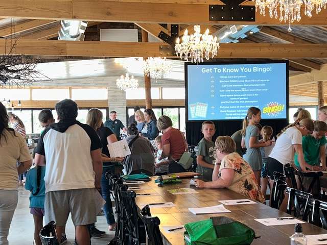 Youth Crew members, and their families and friends participate in Get to Know You Bingo, which offers the opportunity to interact with one another. The activity was part of Youth Crew’s End-of-the-Year Celebration on Monday, June 3.