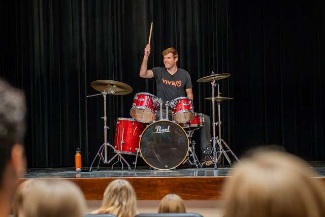Jake White, national drug-prevention speaker, uses his skills at the drums to liven up the audience at the recent YLinK conference at Hoisington High School.
