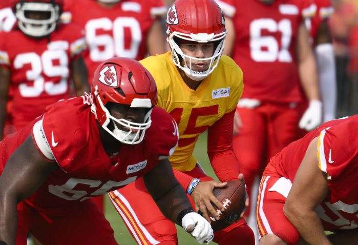 Kansas City Chiefs quarterback Patrick Mahomes takes a snap during NFL football training camp Saturday, July 27, 2024 in St. Joseph, Mo. (AP Photo/Reed Hoffmann)