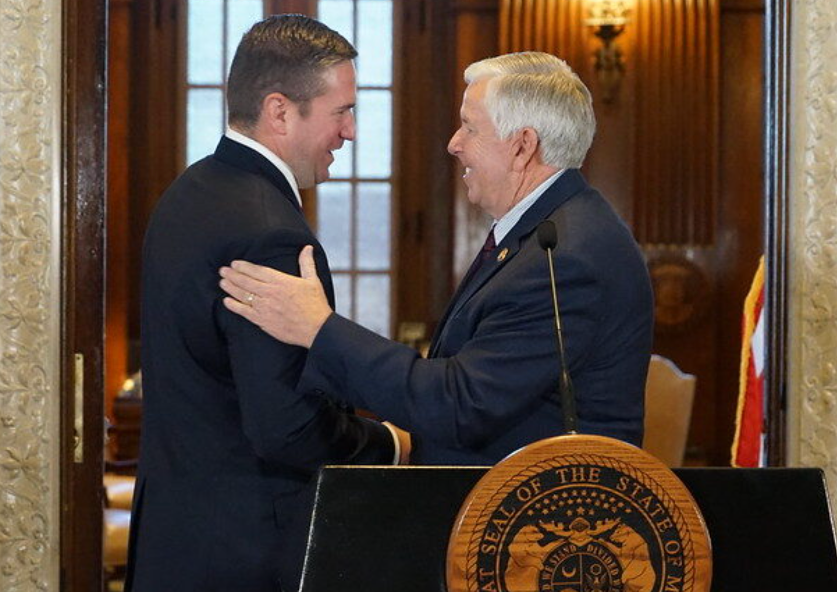  Missouri Gov. Mike Parson congratulates Andrew Bailey on being appointed attorney general on Nov. 23, 2022 (photo courtesy of the Missouri Governor’s Office).