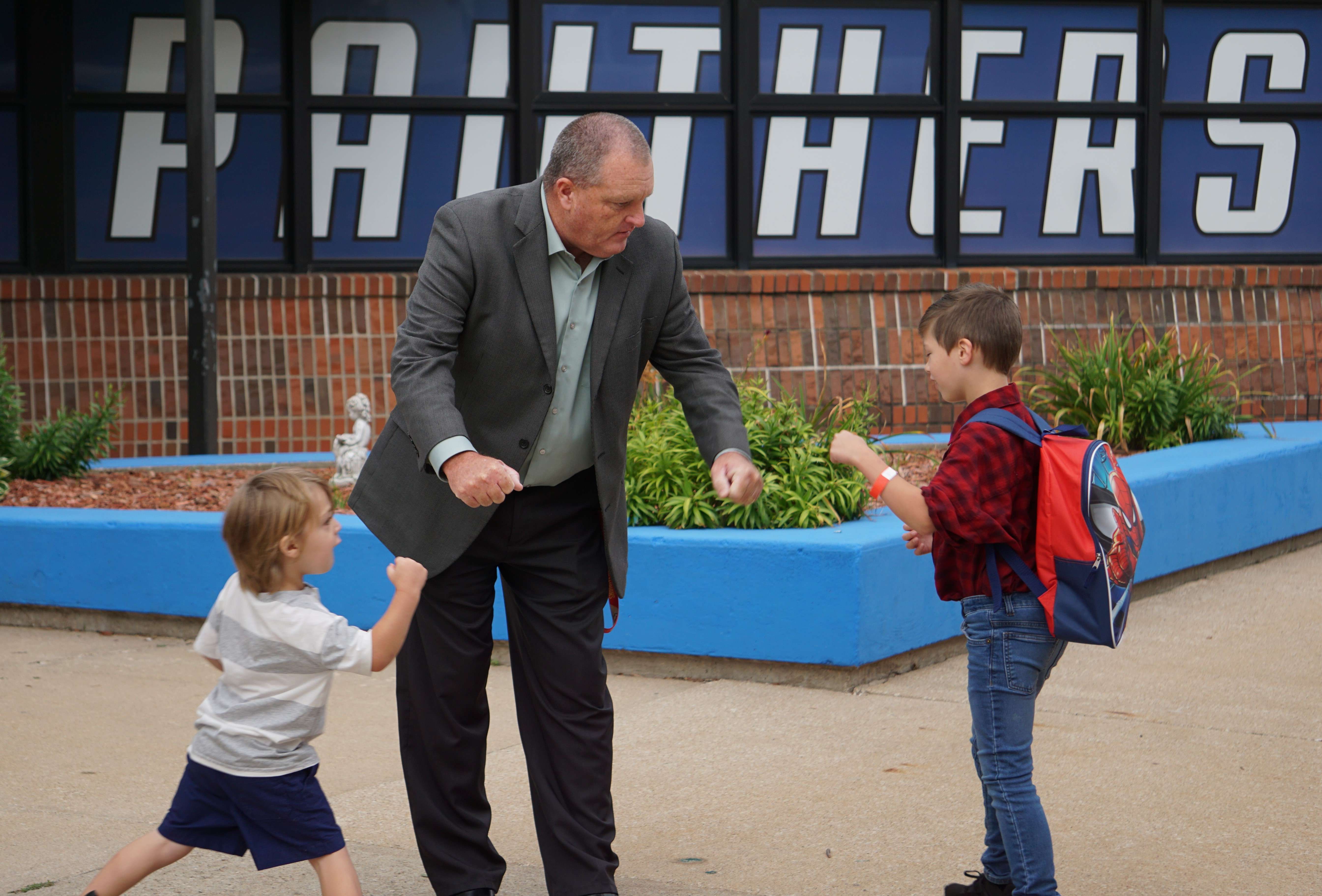Gabe Edgar and two students from Parkway Elementary School on the first day of school/ Photo by Matt Pike