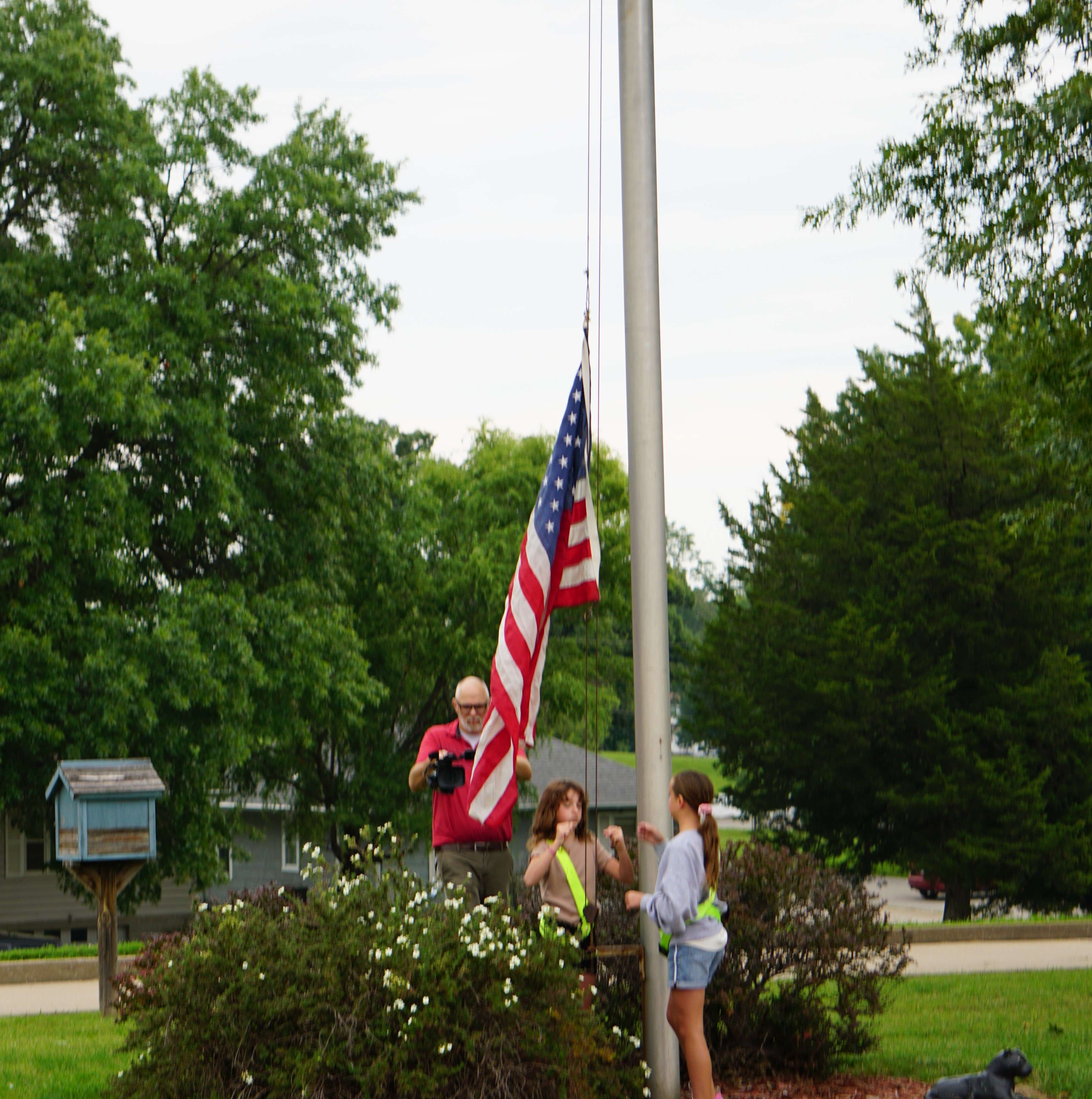 Students raise the flag at Parkway Elementary School on the first day of school/ Photo by Matt Pike
