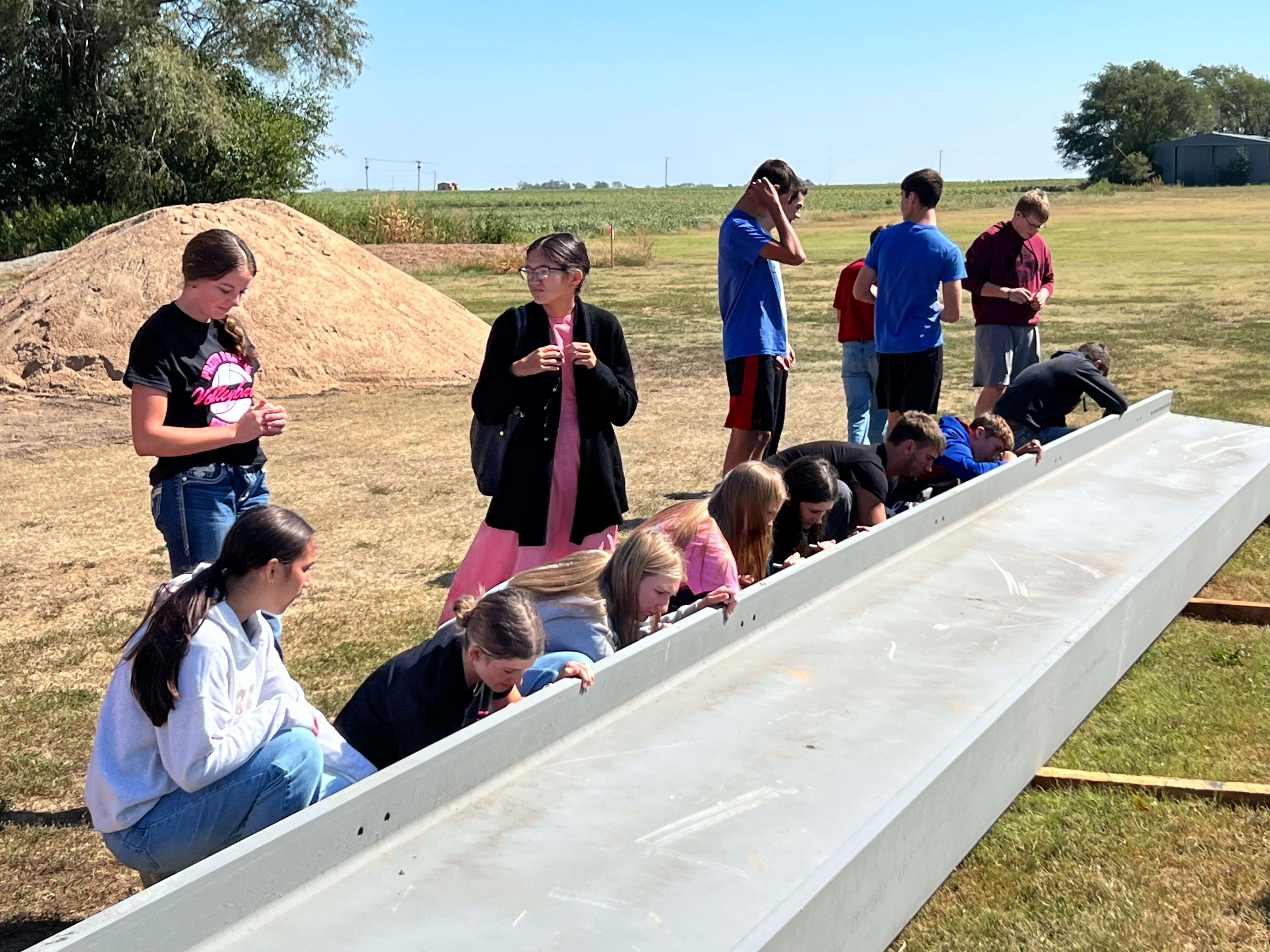Pretty Prairie USD 311 held a beam signing on Tuesday, Sept. 10, 2024, for its middle school gym expansion. (Sean Boston/Hutch Post Photo)