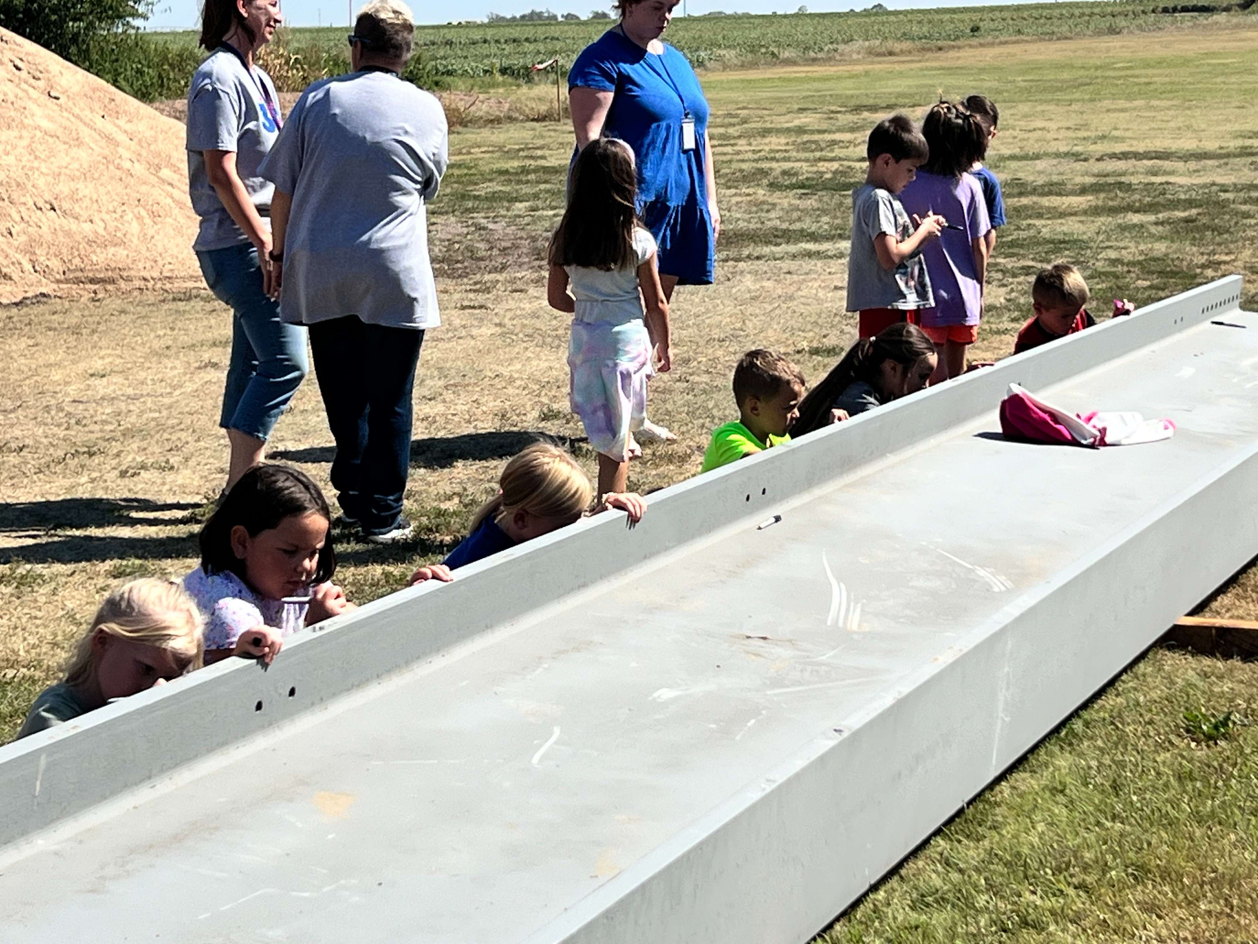 Pretty Prairie USD 311 held a beam signing on Tuesday, Sept. 10, 2024, for its middle school gym expansion. (Sean Boston/Hutch Post Photo)