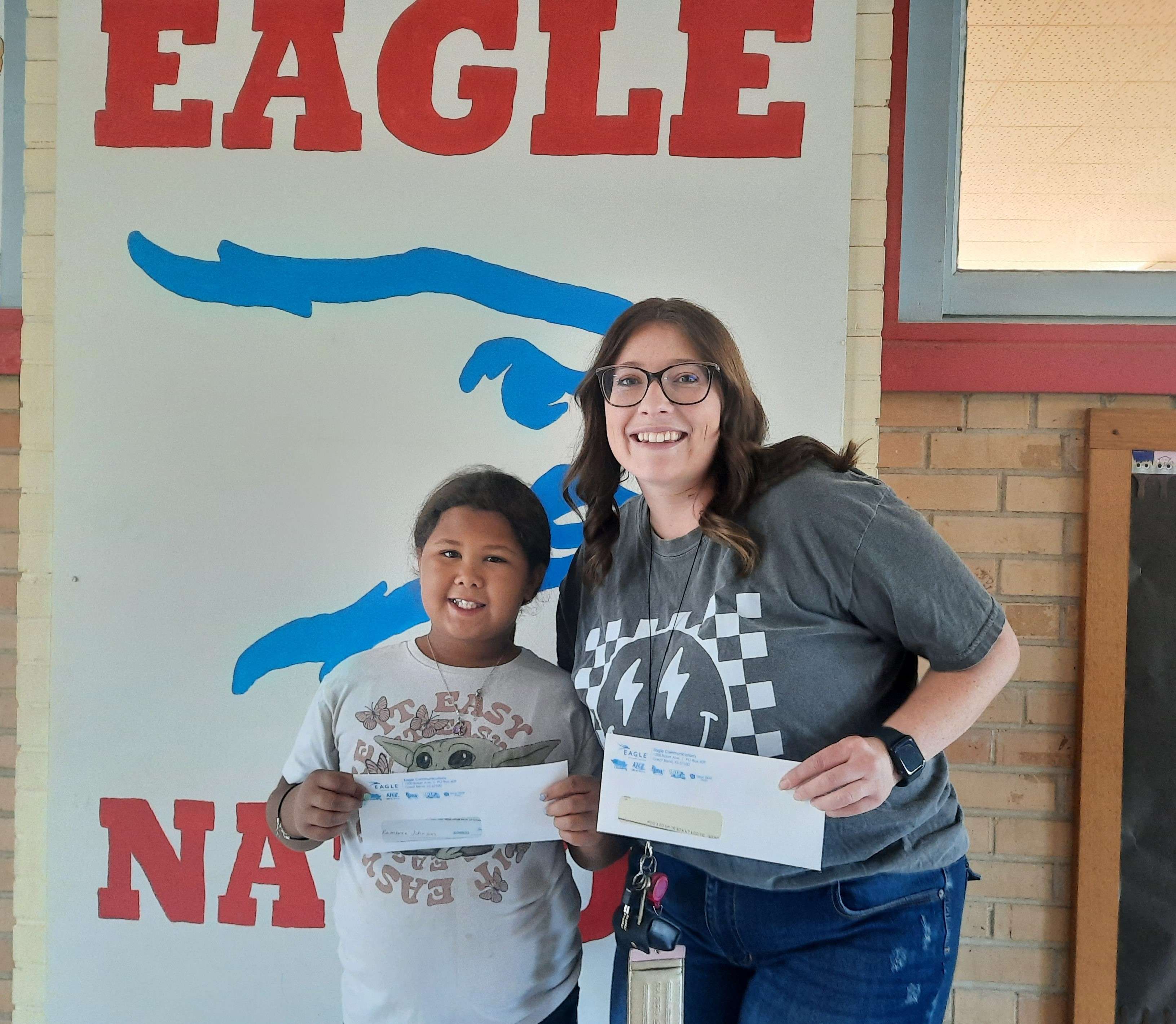 Ellinwood fourth grader Kambree Johnson and her teacher, Rebecca Hoffhines, were this year's first winners of Eagle Media's Make a Difference Contest.
