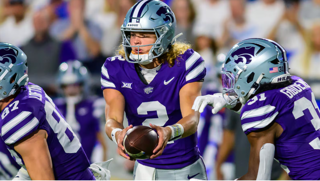 Kansas State quarterback Avery Johnson (2) hands the football off to running back DJ Giddens (31) during an NCAA football game against BYU, Saturday, Sept. 21, 2024, in Provo, Utah. (AP Photo/Tyler Tate)(Tyler Tate | AP)