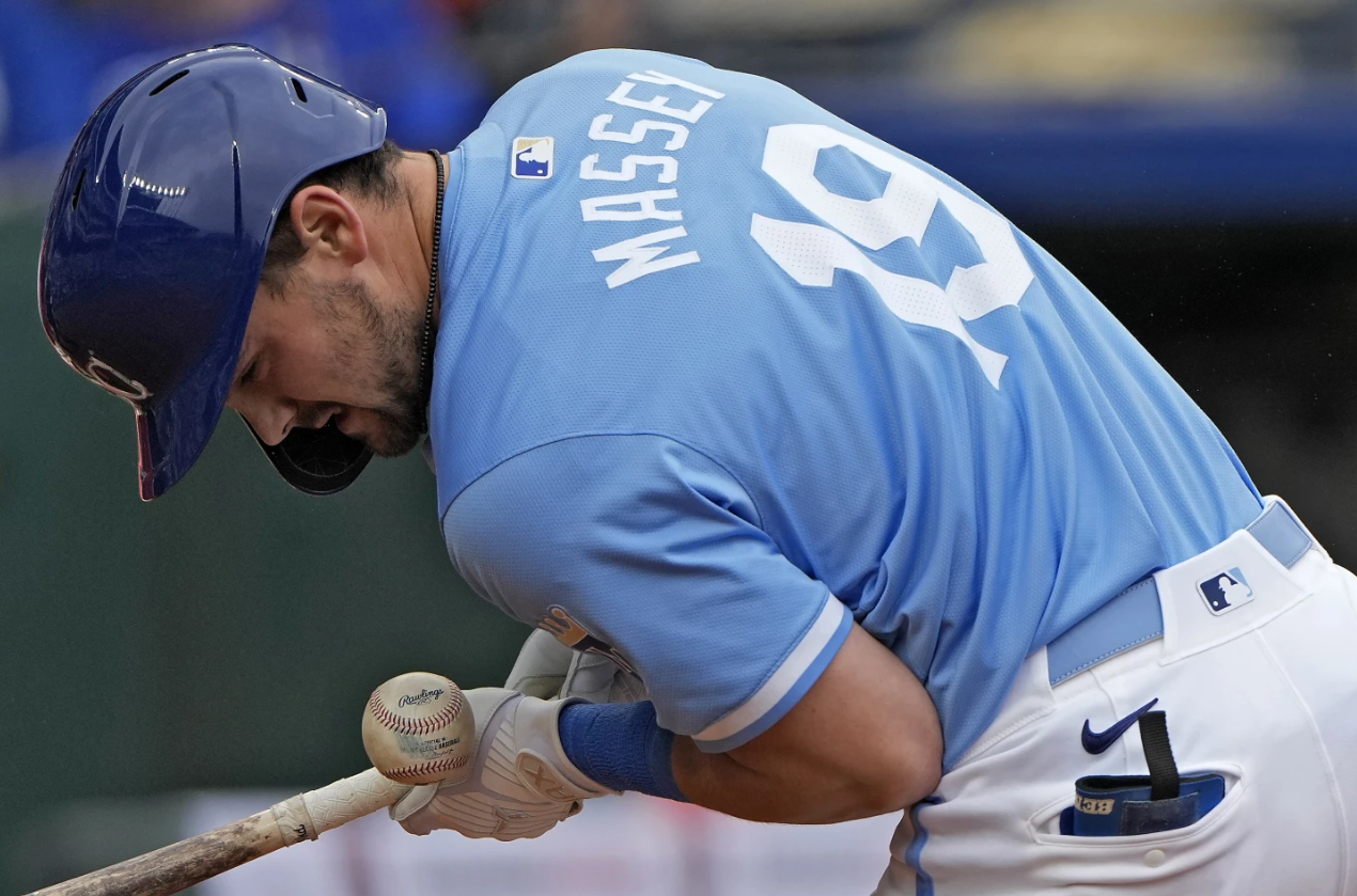 Kansas City Royals' Michael Massey is hit by a pitch thrown by San Francisco Giants relief pitcher Tyler Rogers during the eighth inning of a baseball game Sunday, Sept. 22, 2024, in Kansas City, Mo. (AP Photo/Charlie Riedel)