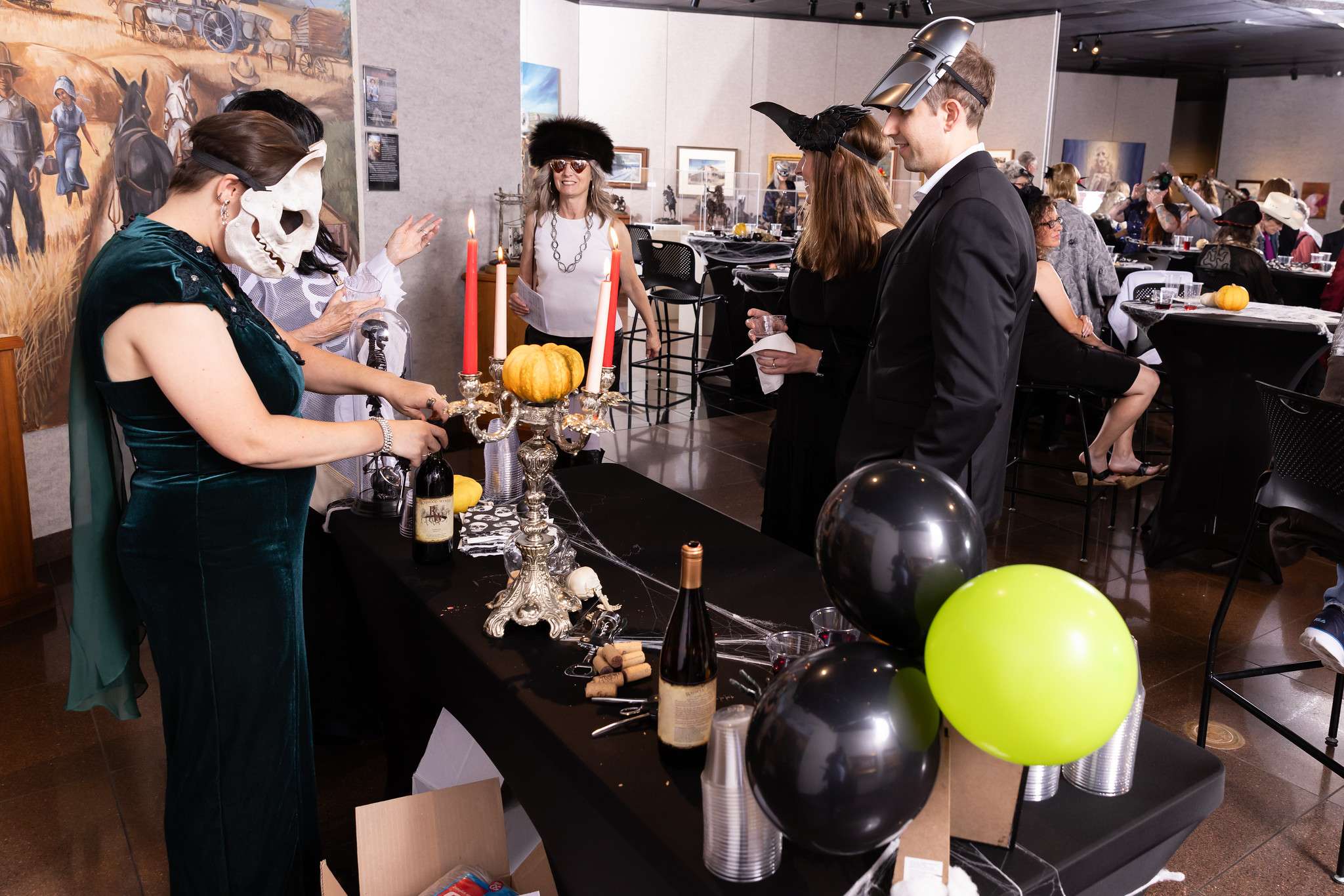 Attendees grab a beverage at last year’s “McKown Masquerade Ball” in the Shafer Gallery.