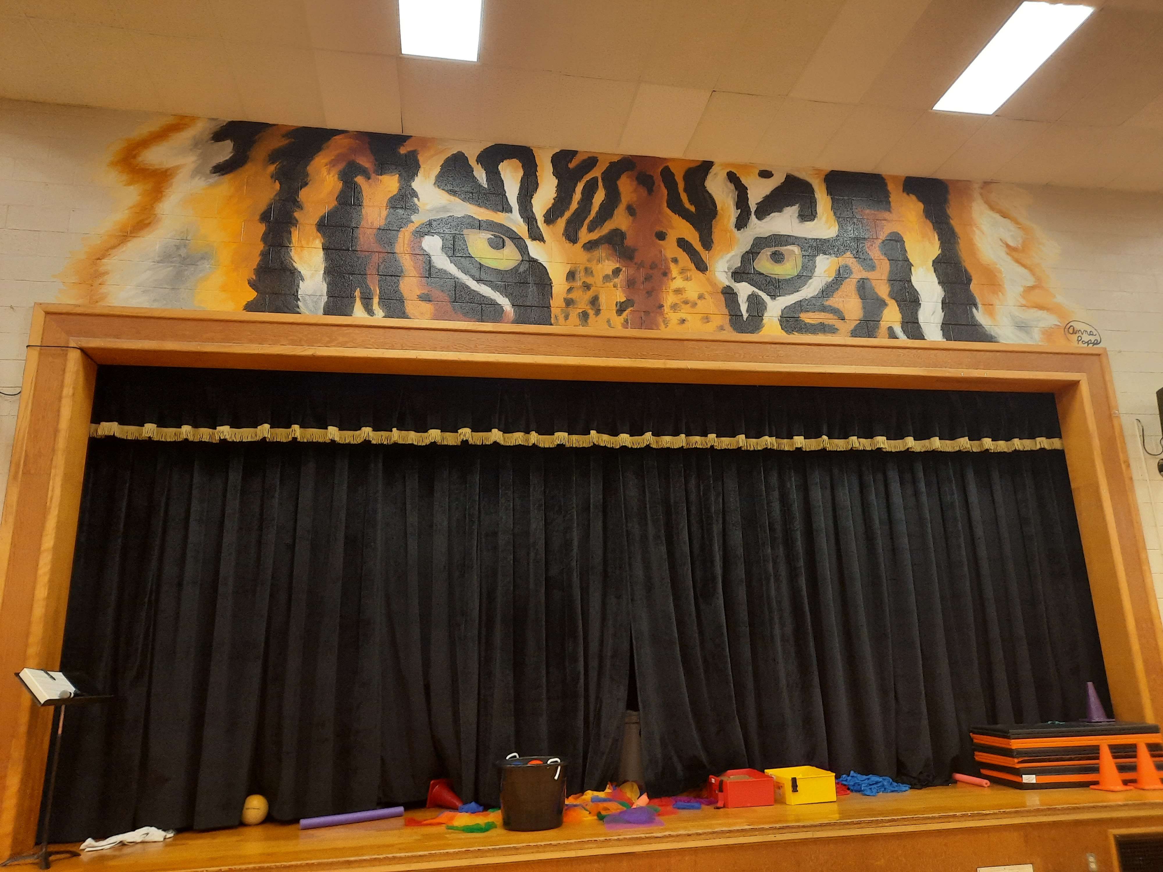 Anna Popp recently updated two murals inside the Park School gymnasium.