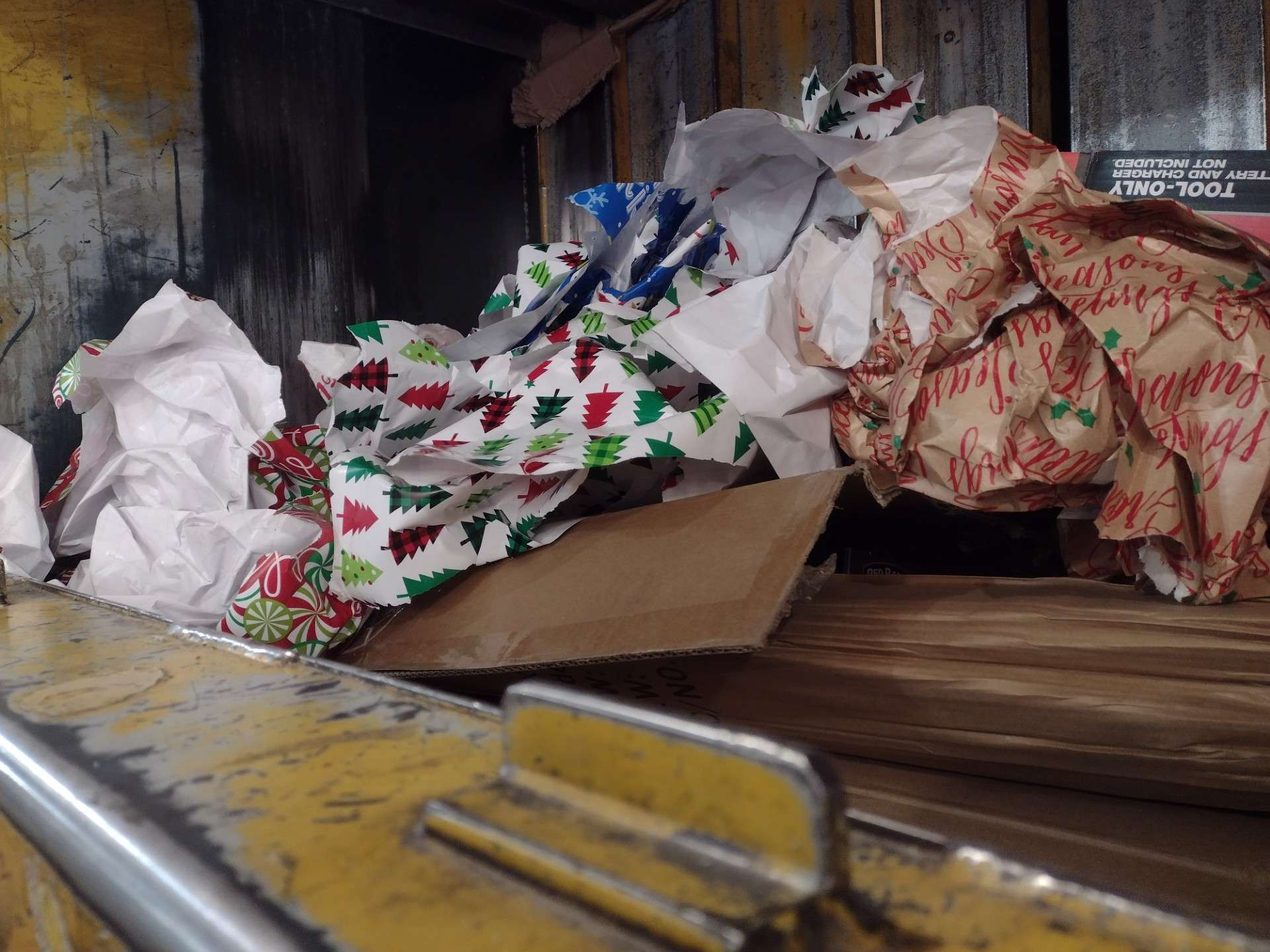 Wrapping paper livens up a baler at the KAB Recycling Center the day after Christmas.