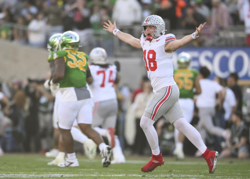 Ohio State quarterback Will Howard celebrates a touchdown against Oregon during the first half of the Rose Bowl on Jan. 1, 2025. (AP Photo/Kyusung Gong)