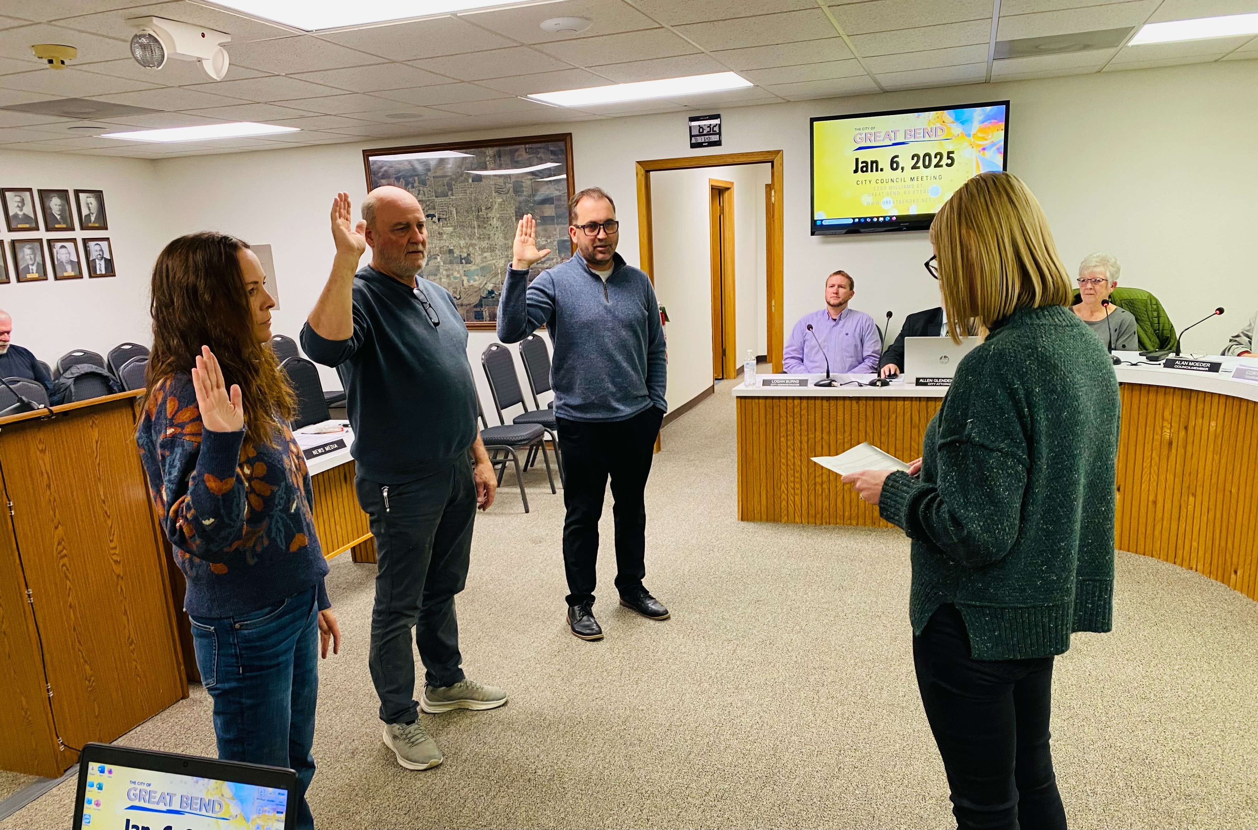 Great Bend City Clerk Shawn Schafer (right) administers the Oath of Office to recently elected city council members Tina Mingenback, Gary Parr and Kevyn Soupiset on Monday, Jan. 6, 2025.