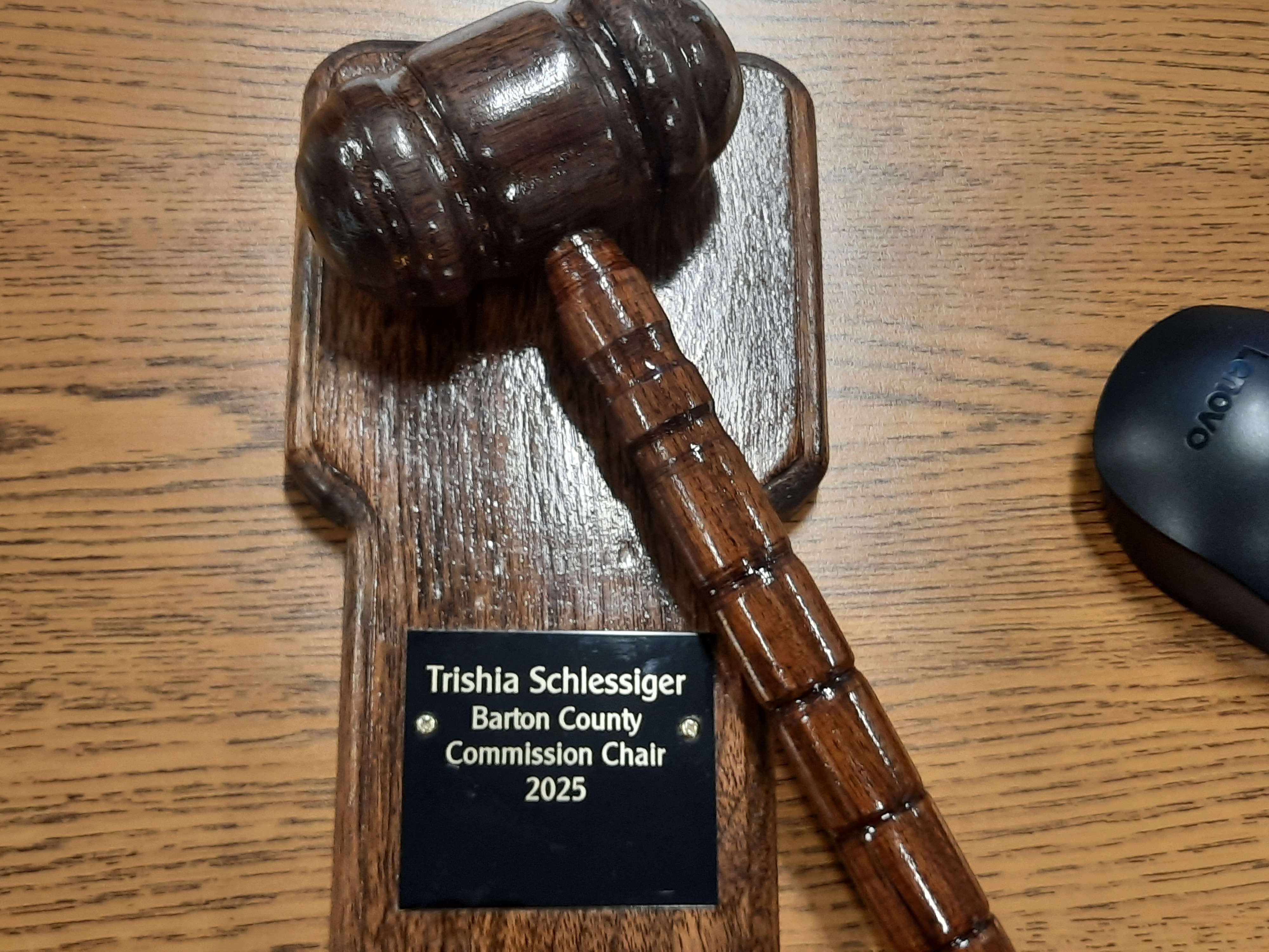 Commissioner Duane Reif presented Schlessiger with a custom gavel following her selection as chairperson.