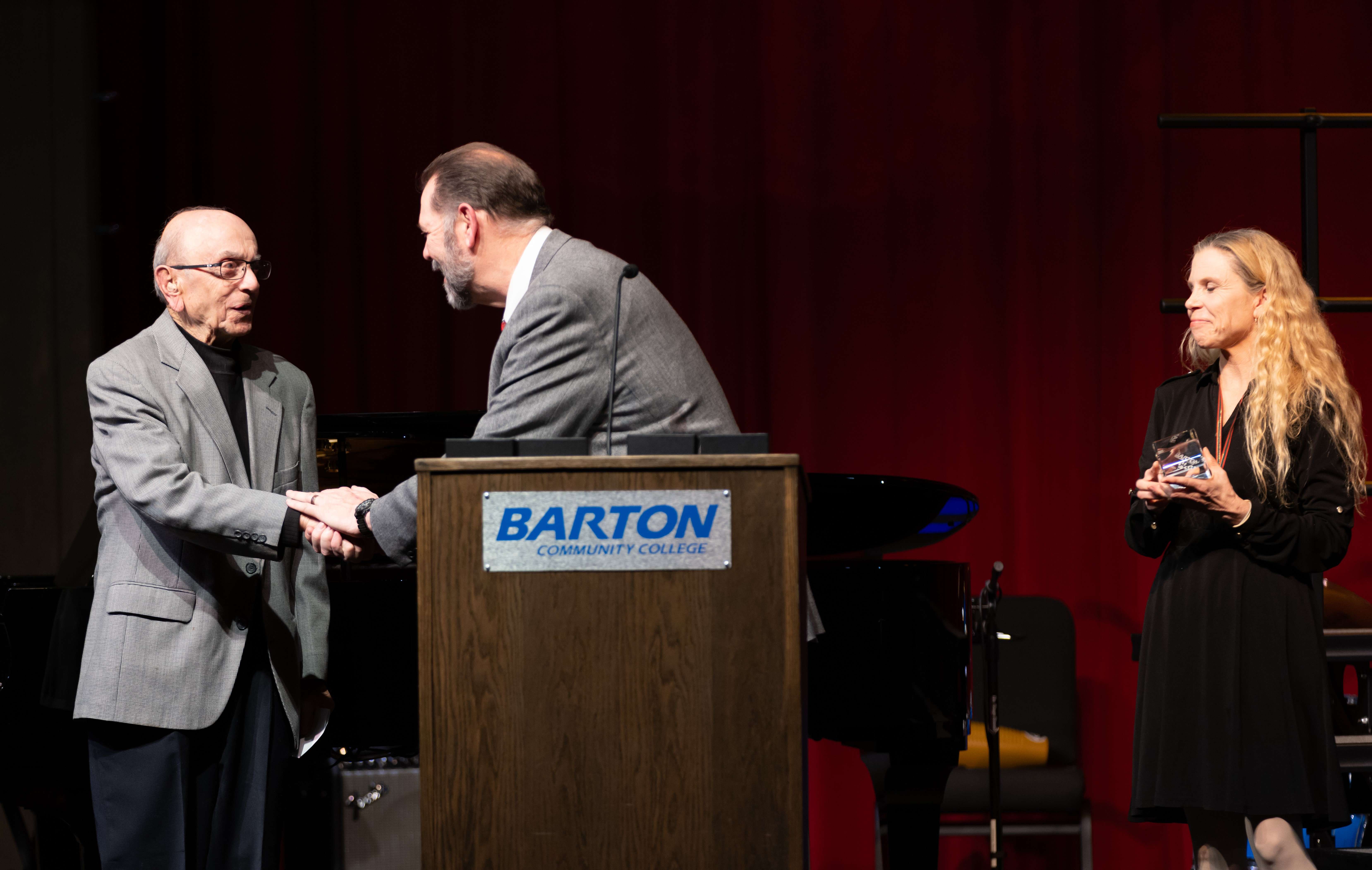 Director of Choral Activities Eric Foley presents Ken Shaheen the Hall of Fame award. Shaheen led Barton’s choral programs for more than two decades and praised the success of Barton’s choral ensembles, many of which he helped establish.