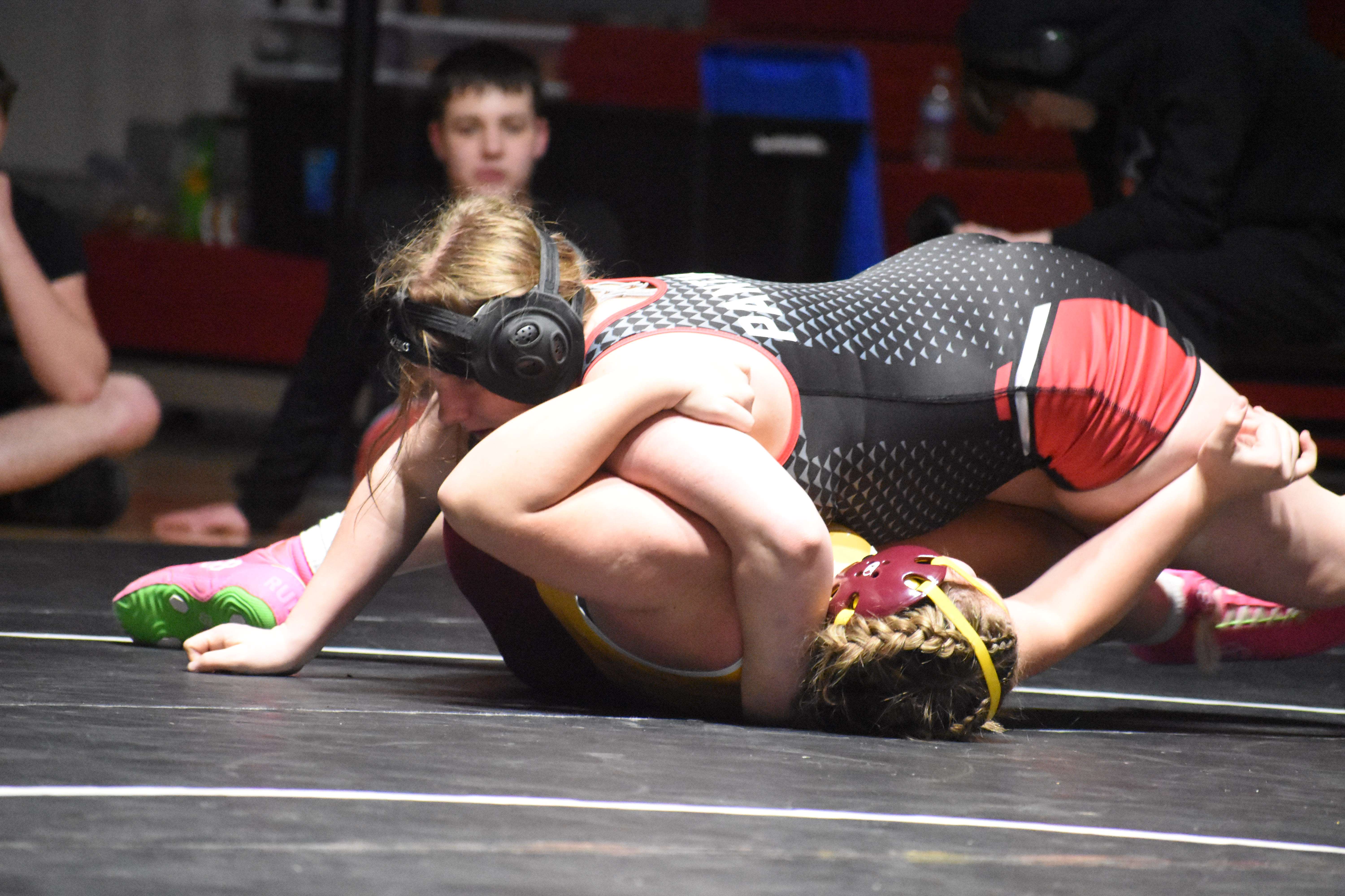 Great Bend senior Kirra Stevens, ranked No. 3 at 170 pounds in Class 5A, sets up the pin against Eleanor Stoffel of Hays, who was ranked No. 2 at 190 pounds during dual action at GBHS on Jan. 21.