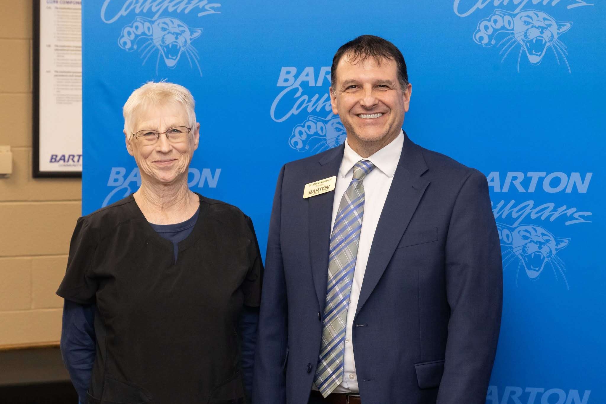 Julia Clemons (left) was recognized by Barton Community College President Dr. Marcus Garstecki for 35 years of employment at the college.