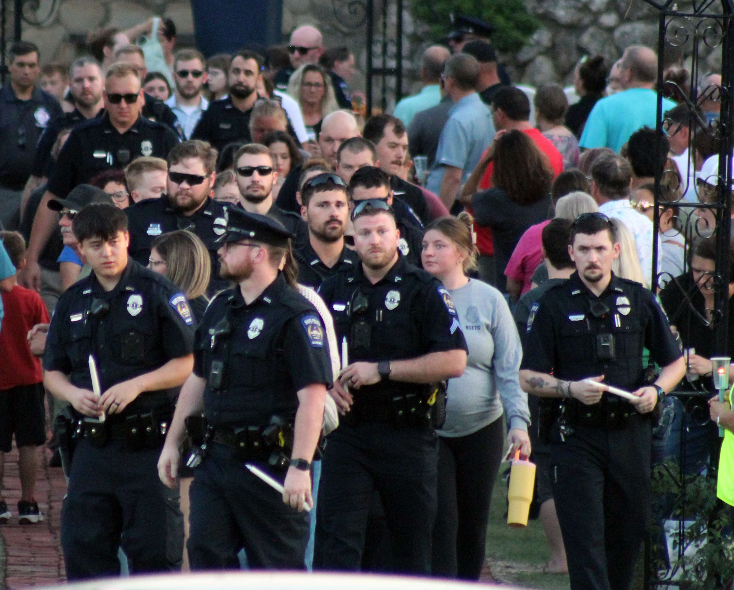 Law enforcement officers leaving the vigil for Sgt. Scott Heimann, who was killed in the line of duty. Photo by Cristina Janney/Hays Post