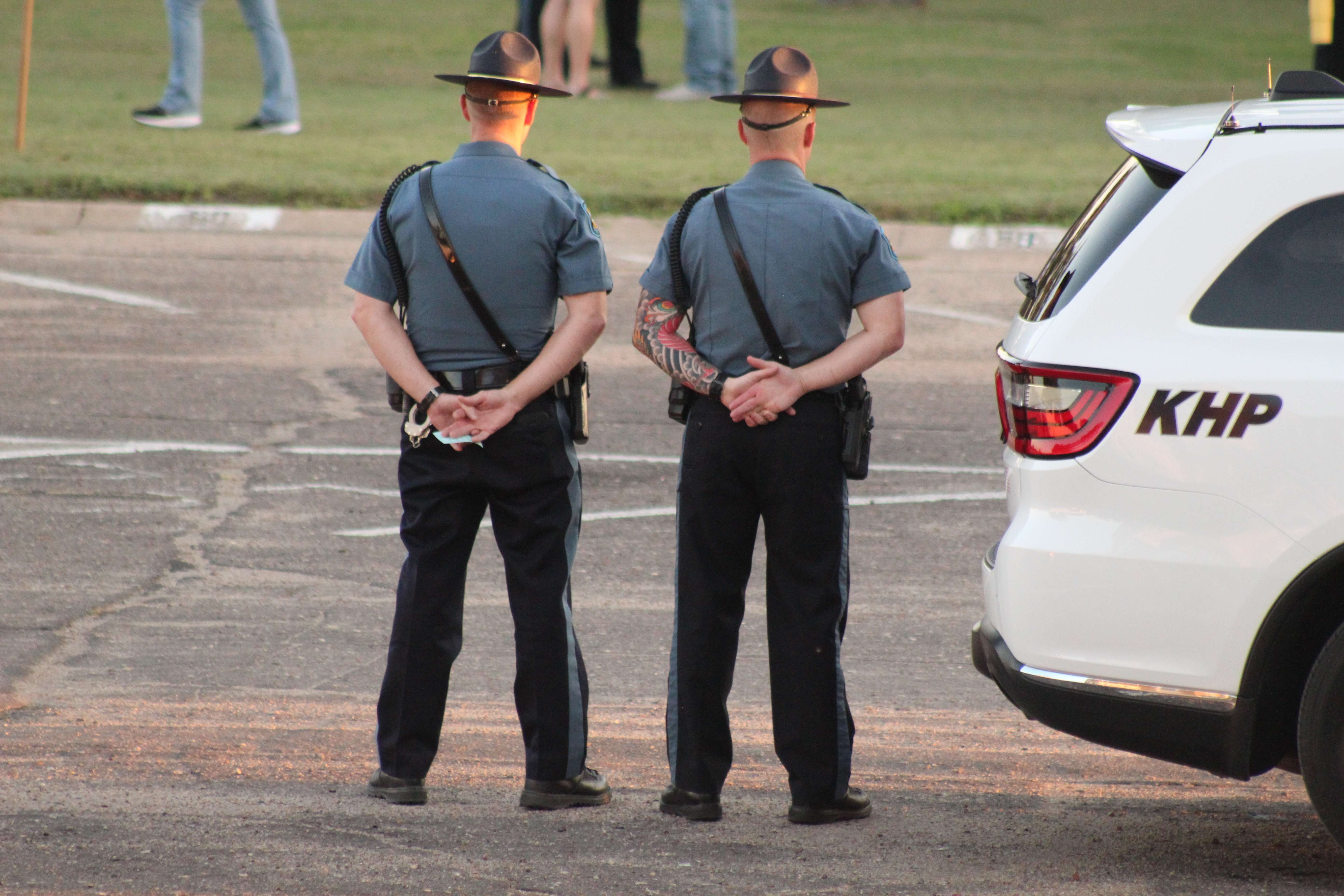 Kansas Highway Patrol officers stand at attention at the vigil for Hays Police Sgt. Scott Heimann, who was killed in the line of duty on Sunday. Photo by Cristina Janney/Hays Post