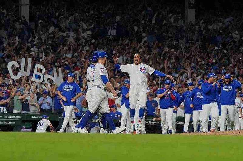 The Chicago Cubs celebrate after Game 3 of a National League wild card baseball game against the San Diego Padres Thursday, Oct. 2, 2025, in Chicago. (AP Photo/Nam Huh)