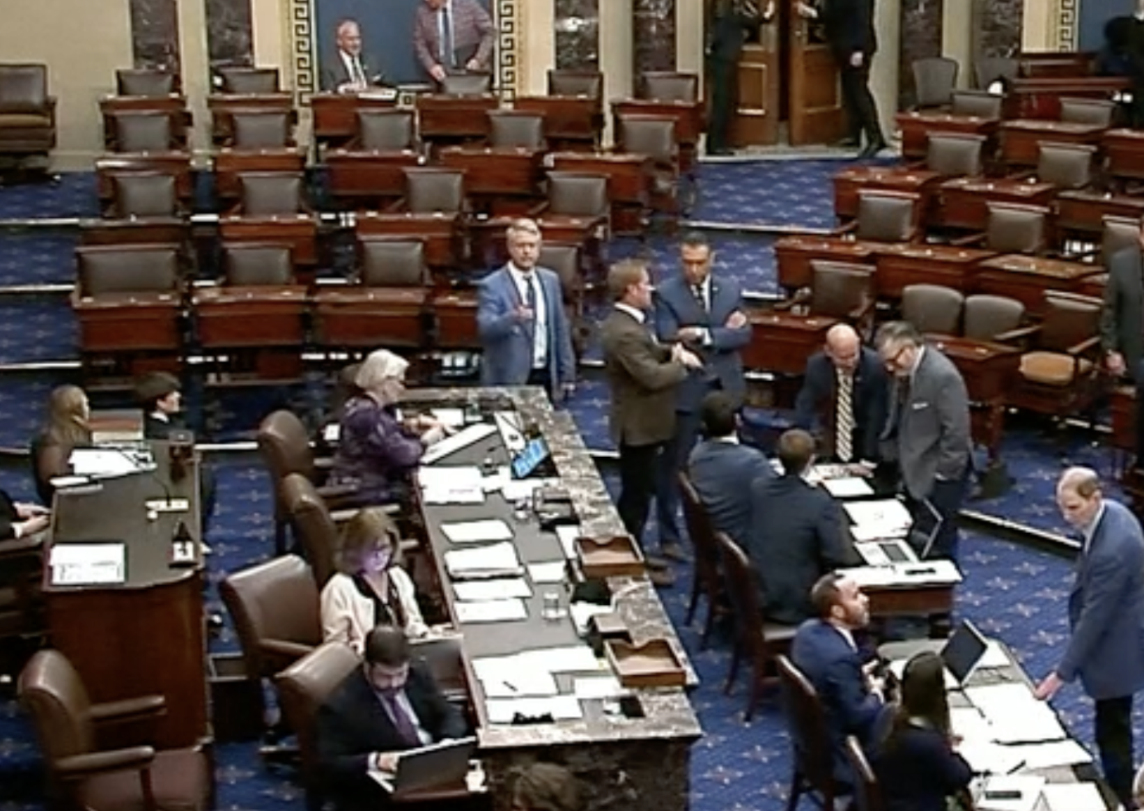 Kansas U.S. Senator Roger Marshall (center) votes on the Senate floor before beginning his weekend.-image courtesy CSPAN