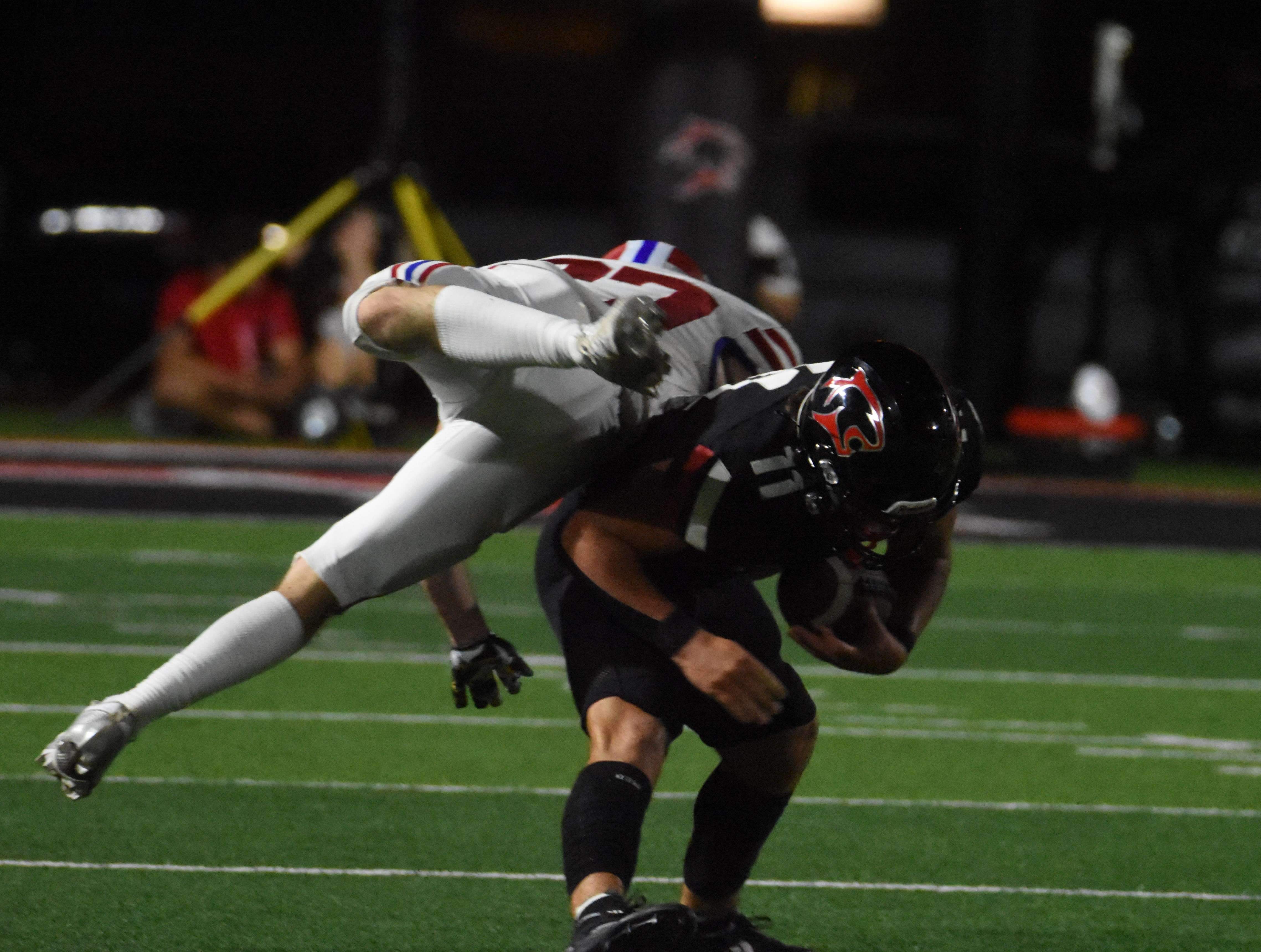 Great Bend senior Koehn Ribordy picks off the second of two passes during Friday's 41-0 win against Dodge City.