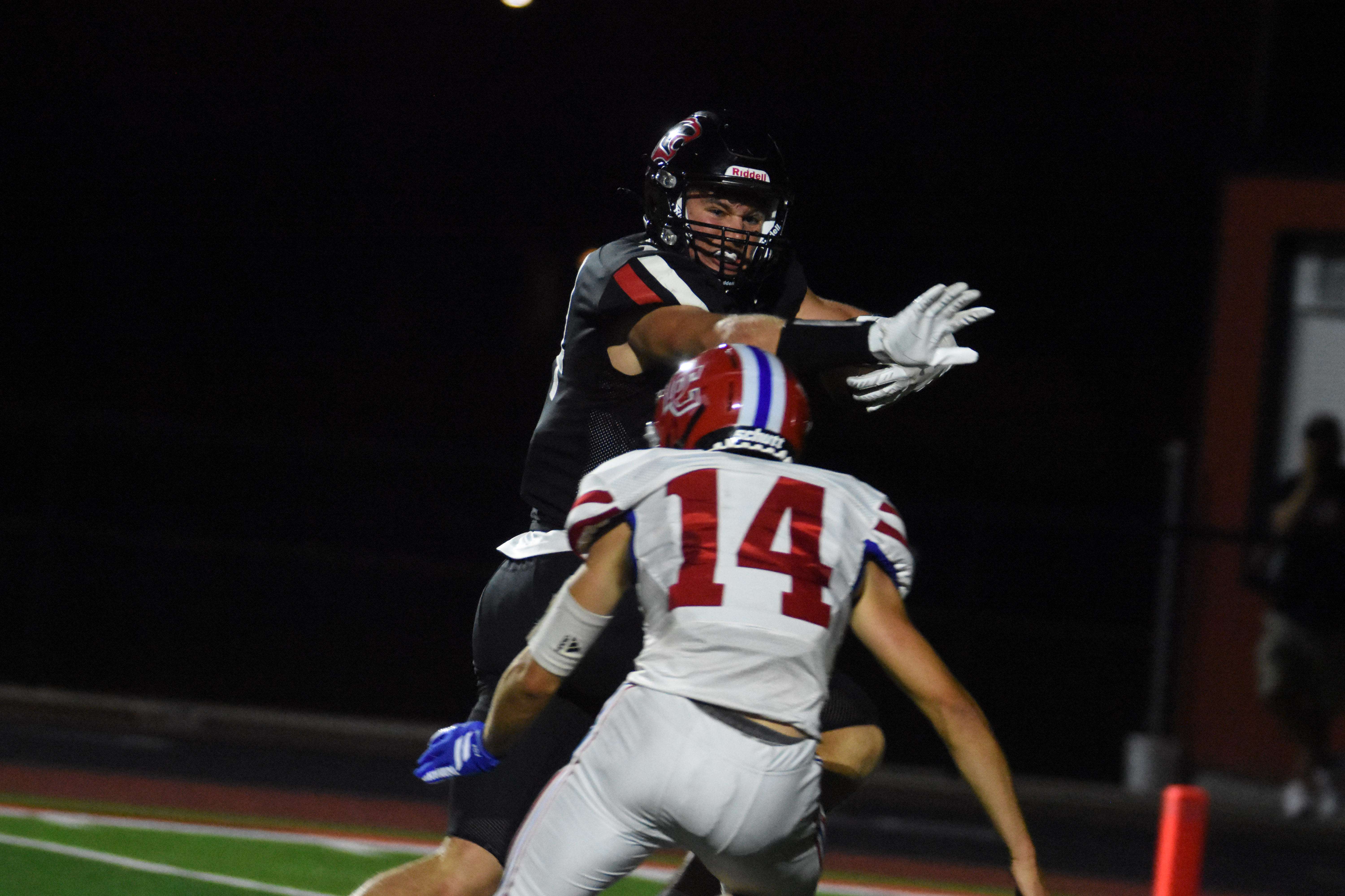 Panther senior Ian Premer keeps Dodge City senior Mason Phelps at bay on a 30-yard touchdown pass from Daxton Minton.