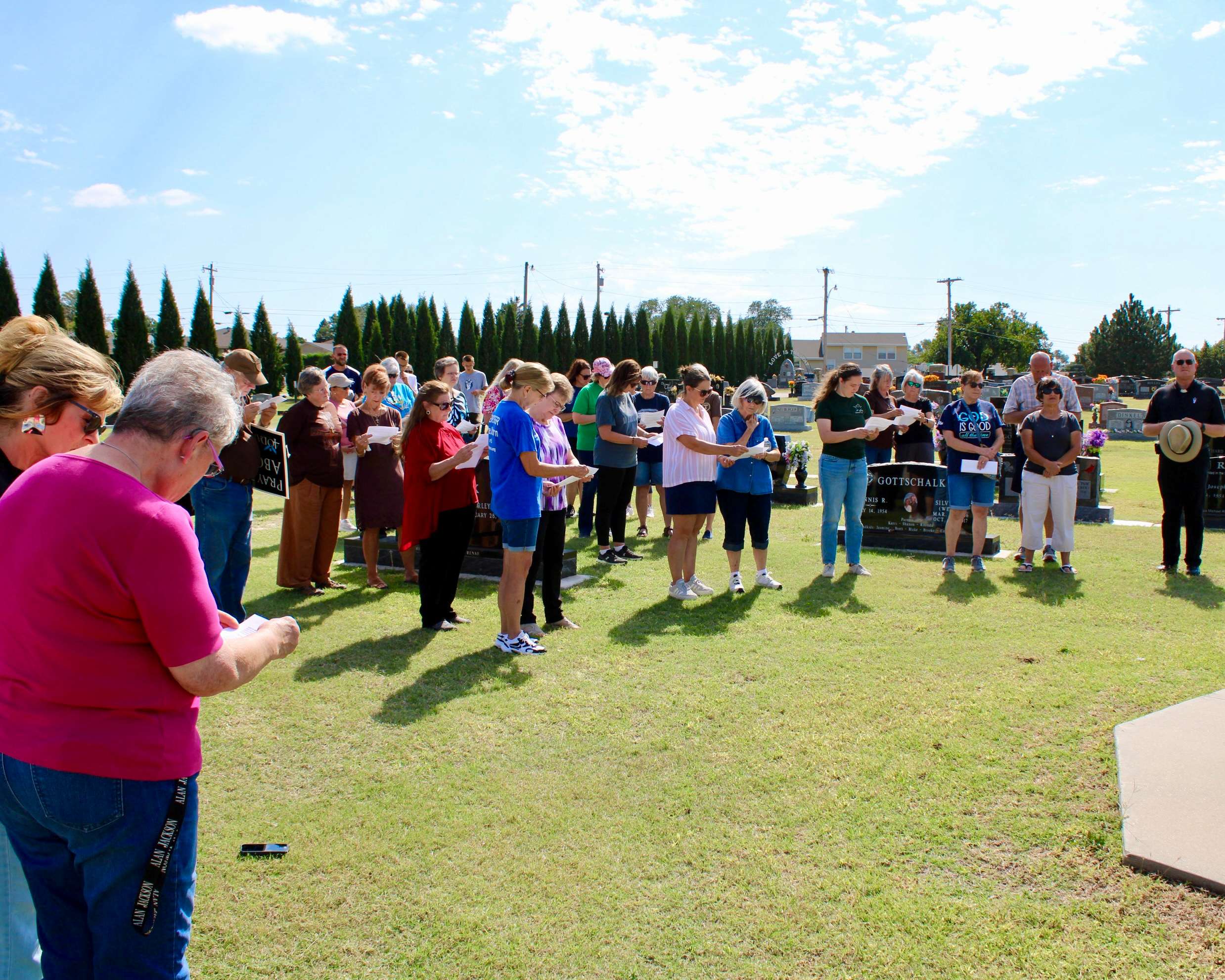 Attendees gathered at St. Joseph Cemetery in Hays for scripture readings from Fr. Nick Parker. Photo by Tony Guerrero/Hays Post