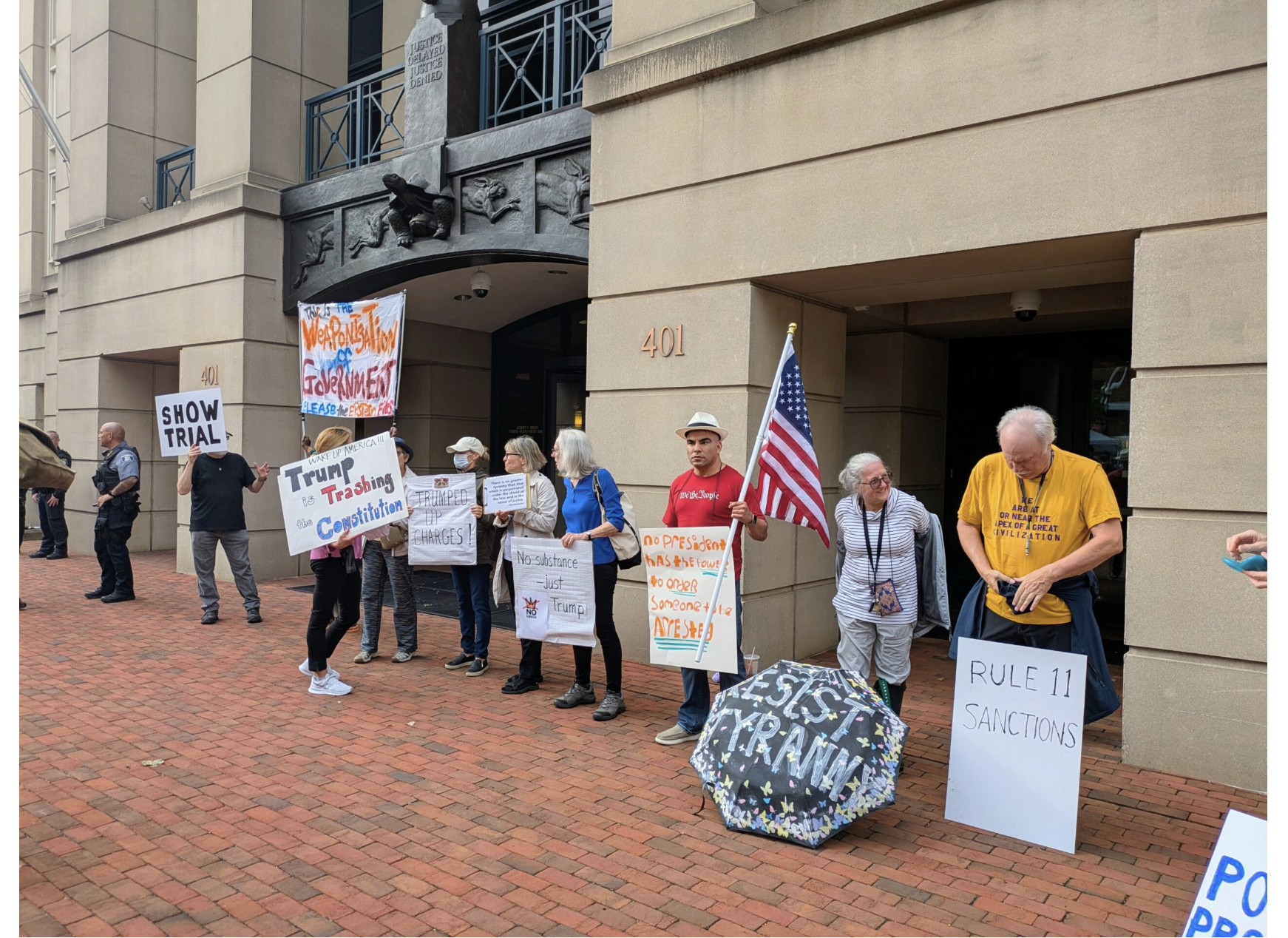 Protesters demonstrated outside the Eastern District of Virginia federal courthouse in Alexandria ahead of the arraignment of former FBI Director James Comey on Wednesday, Oct. 8, 2025. (Photo by Ashley Murray/States Newsroom)