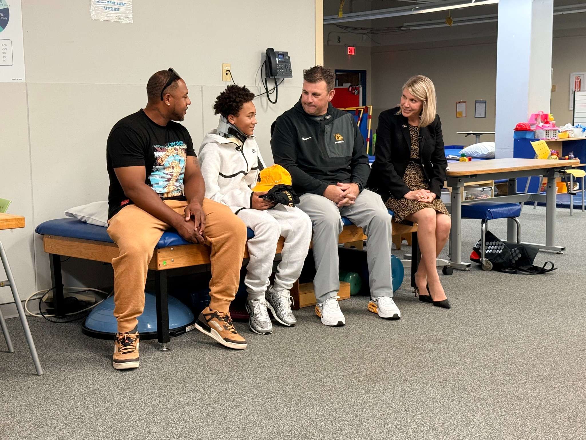 Missouri Western President Elizabeth Kennedy and head football coach Tyler Fenwick met with 14 year old Julius Byers and his family today. Byers, a freshman at Liberty High School dreamed of playing for the Griffons, but suffered an injury early this season that left him partially paralyzed. Byers will serve as an honorary captain for the Griffon football team on Oct. 18th against Pittsburgh State/ Photo courtesy of MoWest on Facebook