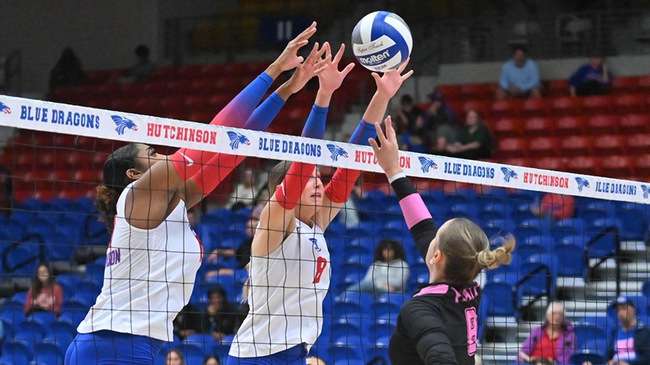 Jaylynn McNeill (left) and Mattie Galliher (center) go up for a block in Blue Dragon Volleyball's 3-0 Jayhawk Conference victory over Pratt on Wednesday at the Sports Arena. (Andrew Carpenter/Digital Fox Photography)