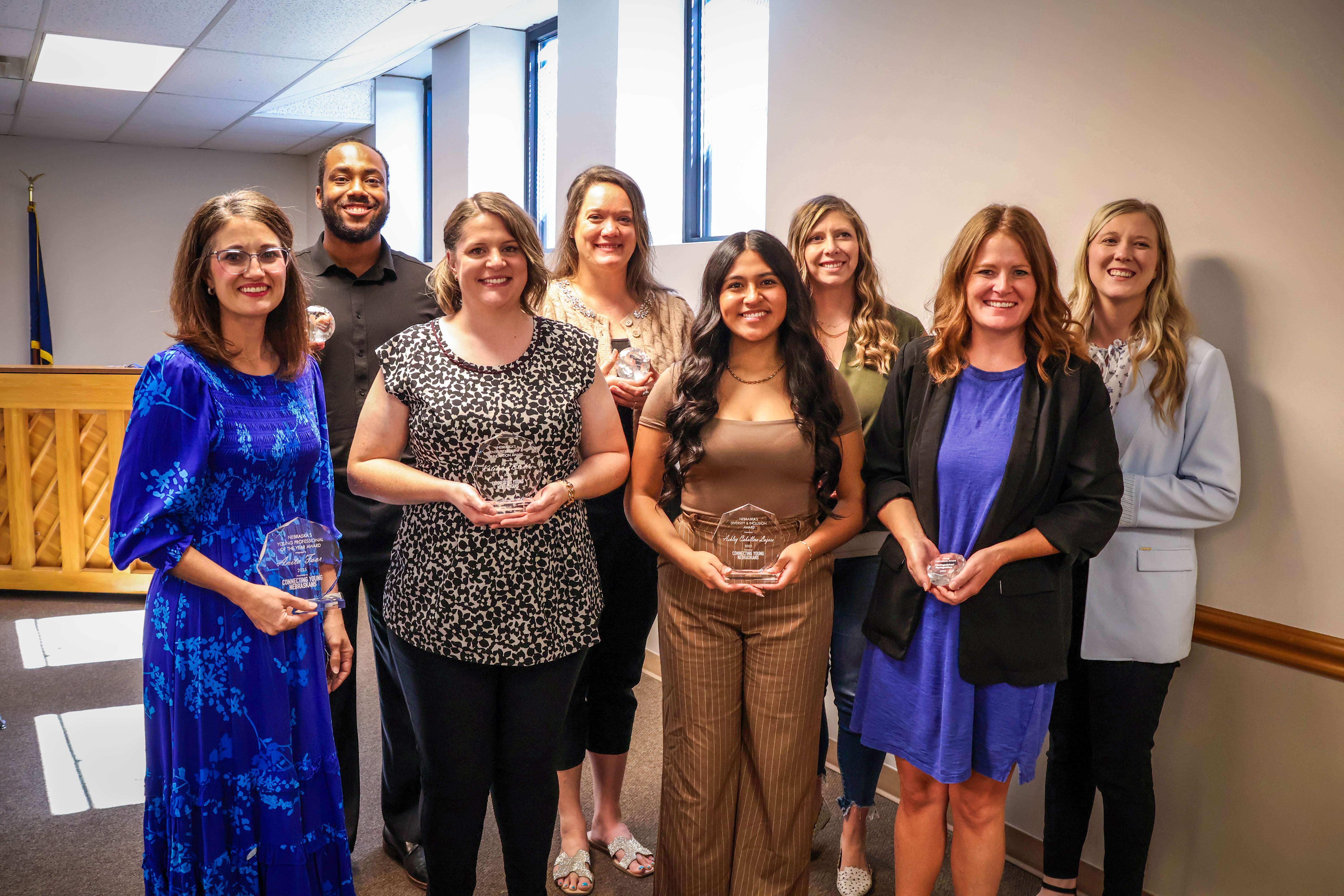 (back row from left to right) Trevon Newmann, Jenn Gjerde, Taylor Wills, Regen Lux  (front row from left to right) Anita Foor, Katelynn Broders, Ashley Caballero Lazaro, Sarah Sinnett. Not pictured: Mynesha Spencer, Channing Reha  CREDIT: Kira Geiger, Nebraska Community Foundation
