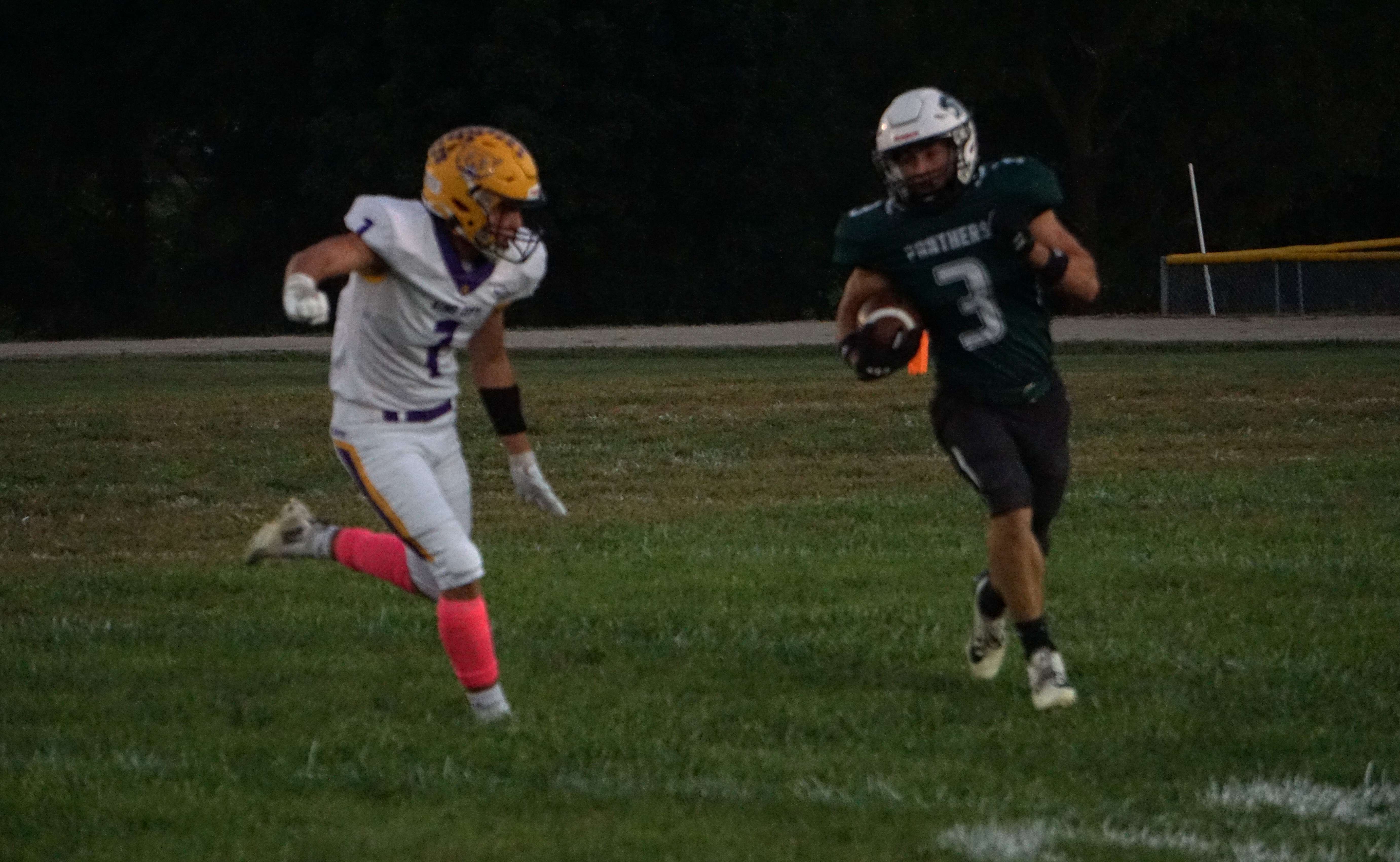 Pattonsburg's Wyatt Maize (3) rounds the corner against King City defender Josiah Schellhorn (7)/ Photo by Matt Pike