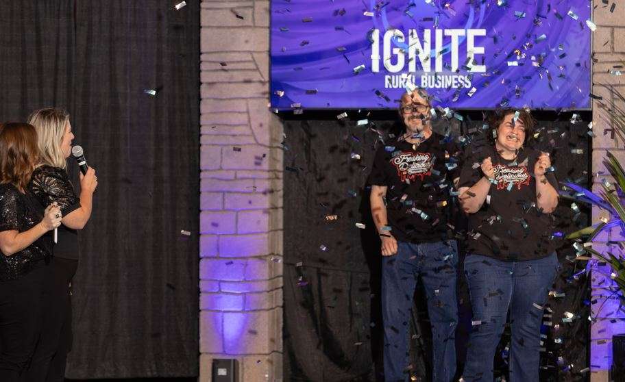 Cartwright celebrates her win after emcees Shannon Towns and Sara Arnberger announce the winner. (photo by Brandon Steinert)