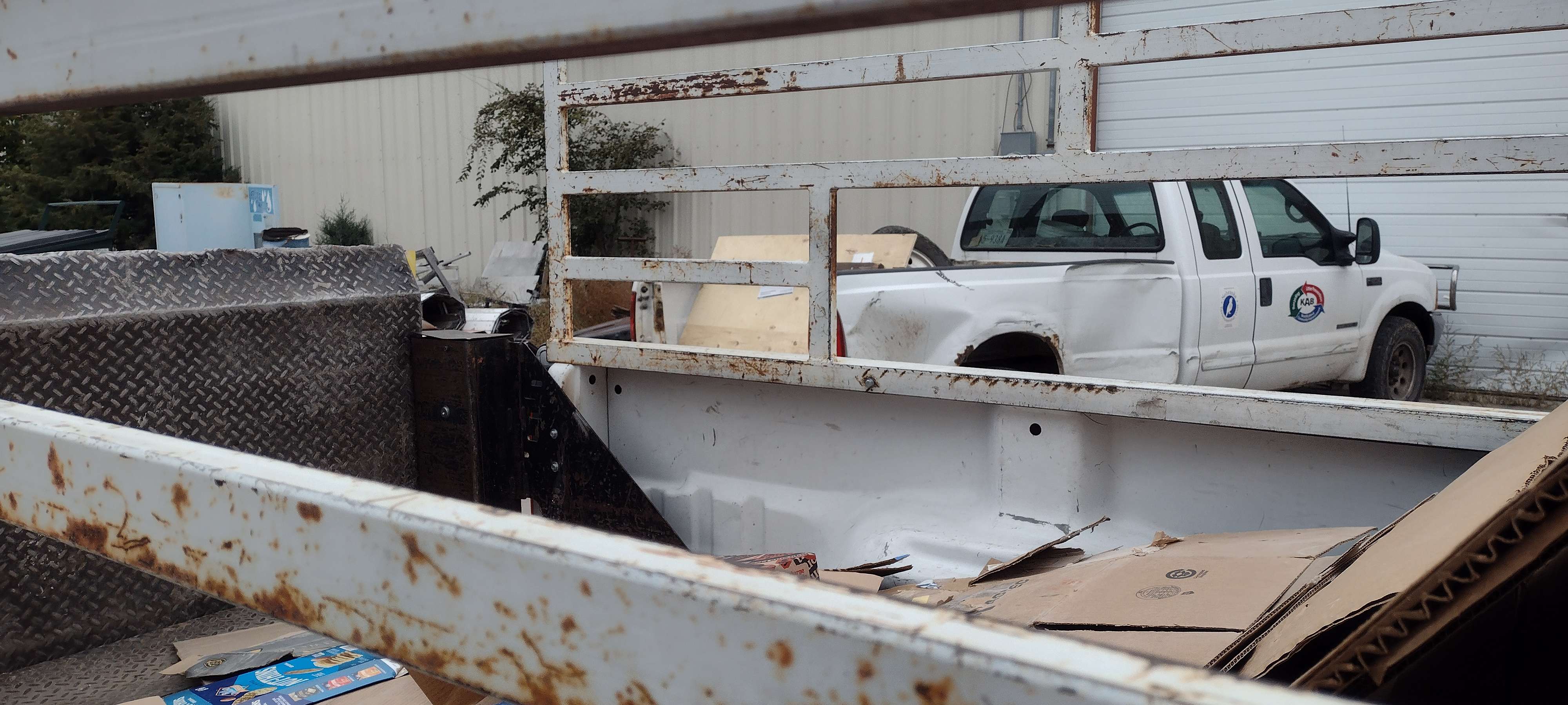 Keep Alliance Beautiful recently retired its 2001 F250, seen through the cage on the back of the organization's 2011 pickup.