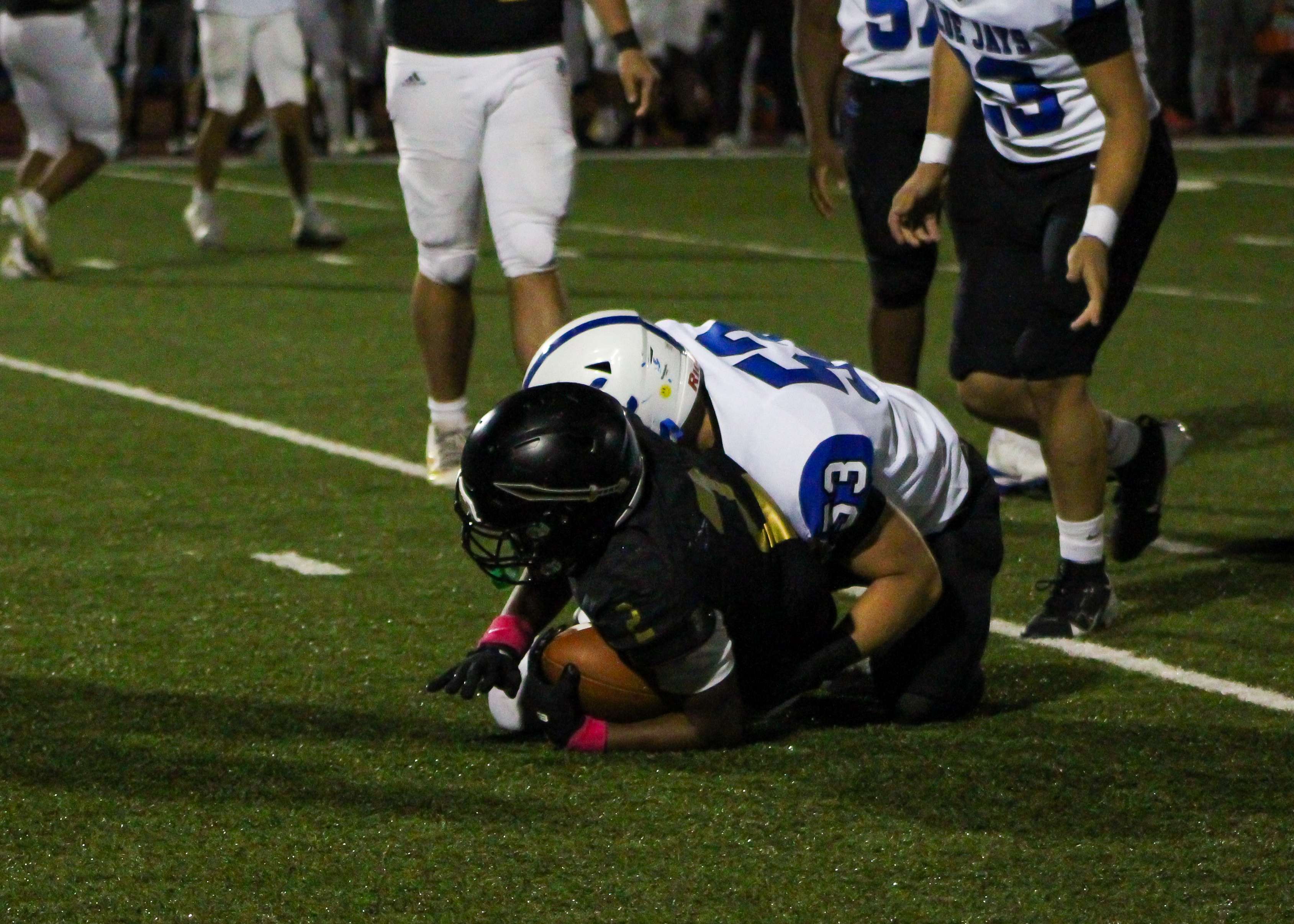 #53 Caleb Schlieman makes a tackle against the Topeka High Trojans on Friday night at Hummer Sports Park. The Blue Jay defense did not allow a touchdown in the game.&nbsp;