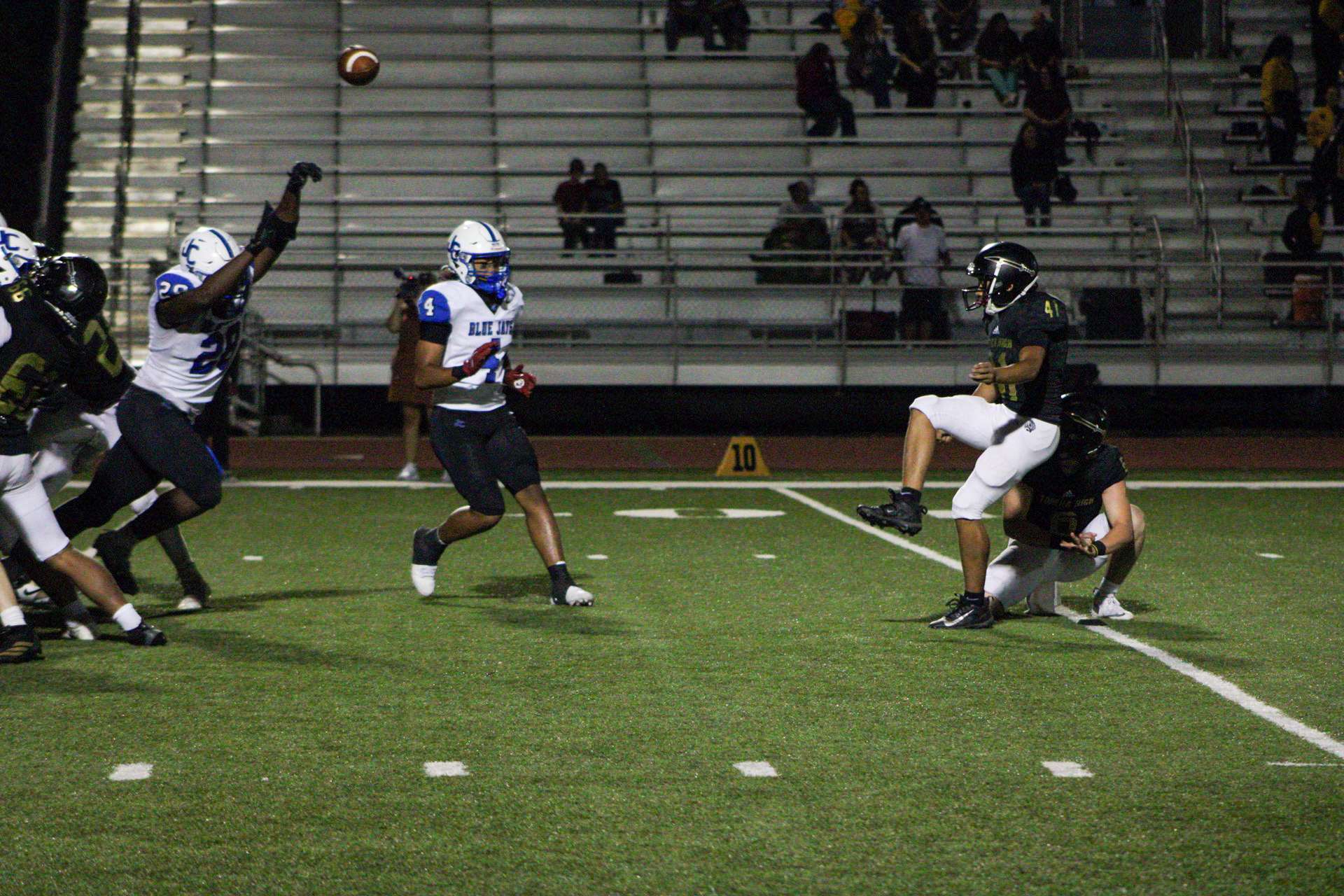 #28 Trevon Briley blocks the PAT in the first half of the game against Topeka High.
