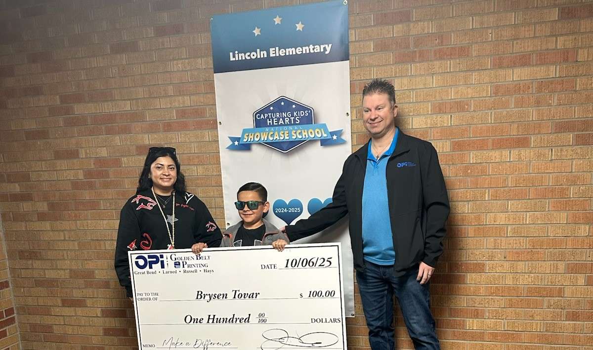 James with OPI presented Lincoln Elementary third grader Brysen Tovar with a giant $100 check as the latest winner in the Make a Difference Contest. Tovar and his teacher, Mrs. Arias, are now eligible for prizes in the monthly contest.