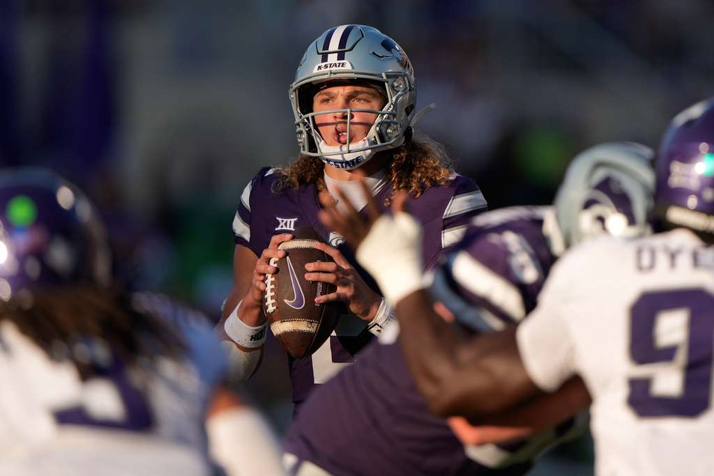 Kansas State quarterback Avery Johnson looks to pass during the second half of an NCAA college football game against TCU, Saturday, Oct. 11, 2025, in Manhattan, Kan. (AP Photo/Charlie Riedel)