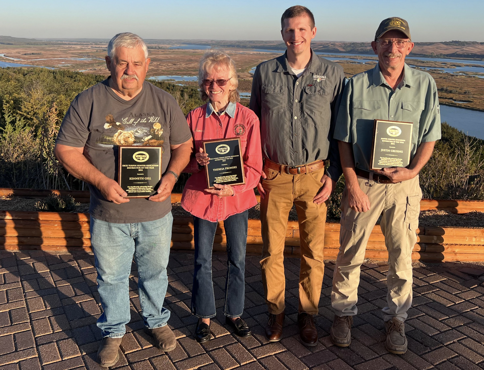Nebraska Hunter Education Coordinator Kyle Gaston, second from right, presented Hunter Education awards Oct.10 at the Nebraska Game and Parks Commission meeting at Niobrara State Park to, from left, Kenneth Gill of Bloomfield, Theresa Pronske of Uehling and Justin Grusing of Firth. (Nebraska Game and Parks Commission)