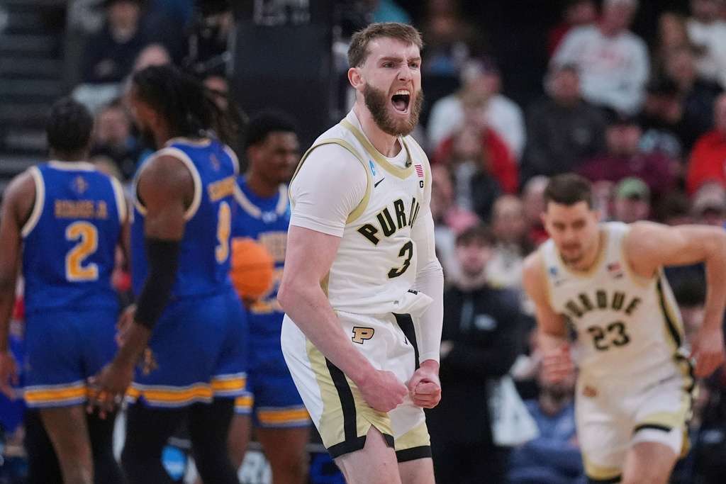 Purdue guard Braden Smith (3) celebrates while taking a lead against McNeese State during the first half in the second round of the NCAA college basketball tournament, Saturday, March 22, 2025, in Providence, R.I. (AP Photo/Charles Krupa, File)