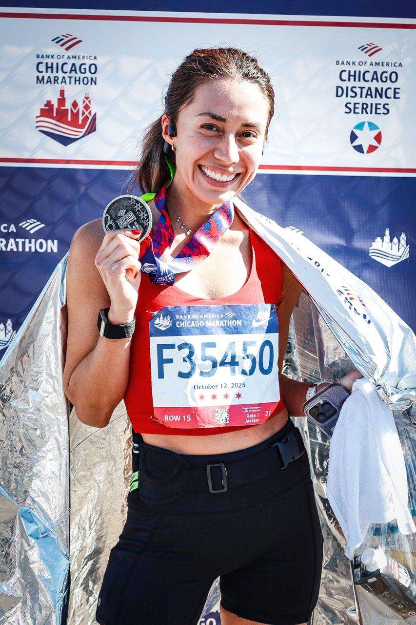 Spray went "retro" with her look Sunday so her mom could identify her in the throng of runners. She wore Panther red and black and added a green ribbon in her hair like she did while at GBHS.