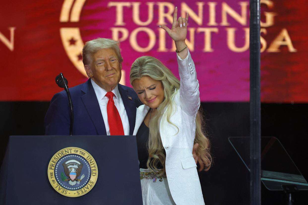 President Donald Trump embraces Erika Kirk during memorial service for her husband, Charlie Kirk, on Sept. 21, 2025. (Photo USA Today)