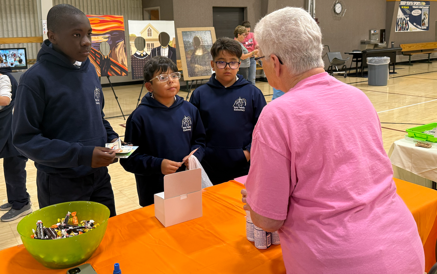 Holy Family students learn about the Cancer Council from a volunteer on Friday at Give Fest.&nbsp;Photo by Cristina Janney/Hays Post