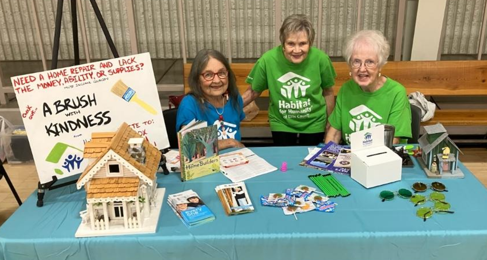 From left Habitat for Humanity of Ellis County volunteers Joyce Jilg, Marilyn Wood and Elaine Pfannenstiel staff a both at the Heartland Community Give Fest on Friday. Habitat for Humanity builds and renovates homes for&nbsp;low-to-moderate income families.&nbsp;Photo by Cristina Janney/Hays Post