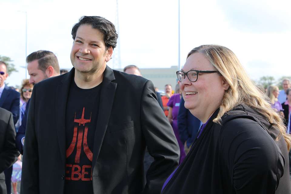 At the K-AIRES groundbreaking ceremony in 2024, Josh Wexler, Pure Imagination Studios CEO, left, smiles and chats with Alysia Starkey, right, as the two celebrate the commencement of construction of the new facility. Courtesy of KSU Salina