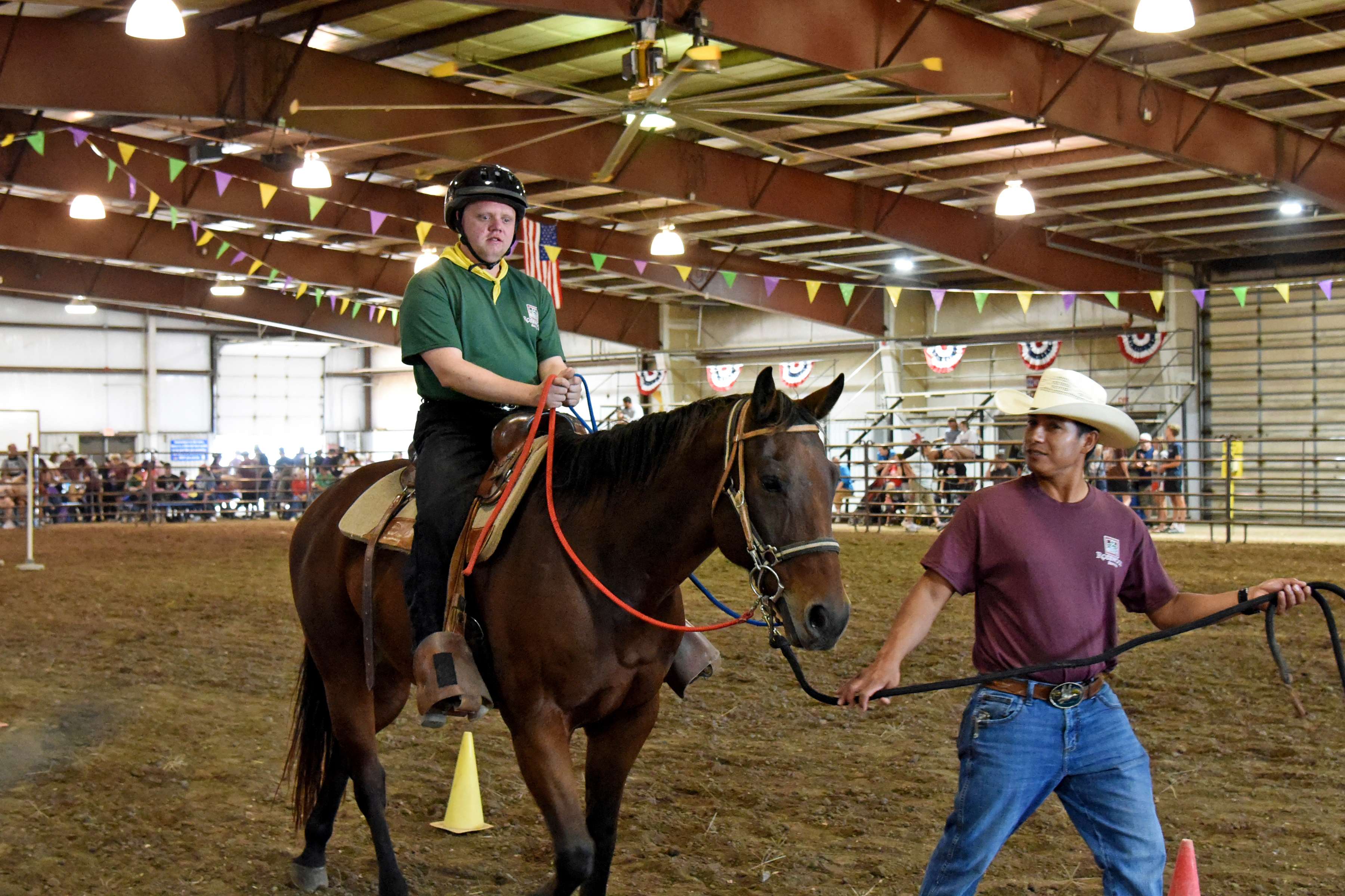 Keith Boyer controls the reins of his horse, “Mr. Red,” during the trail pattern event at the Rosewood Rodeo, held at Barton County Fair Grounds Expo III Arena on Oct. 4. He was led by Rosewood Equine Therapy Instructor Juan Bodine. This was Boyer’s 10th Rodeo and he earned “Most Improved Rider” award for his performances.